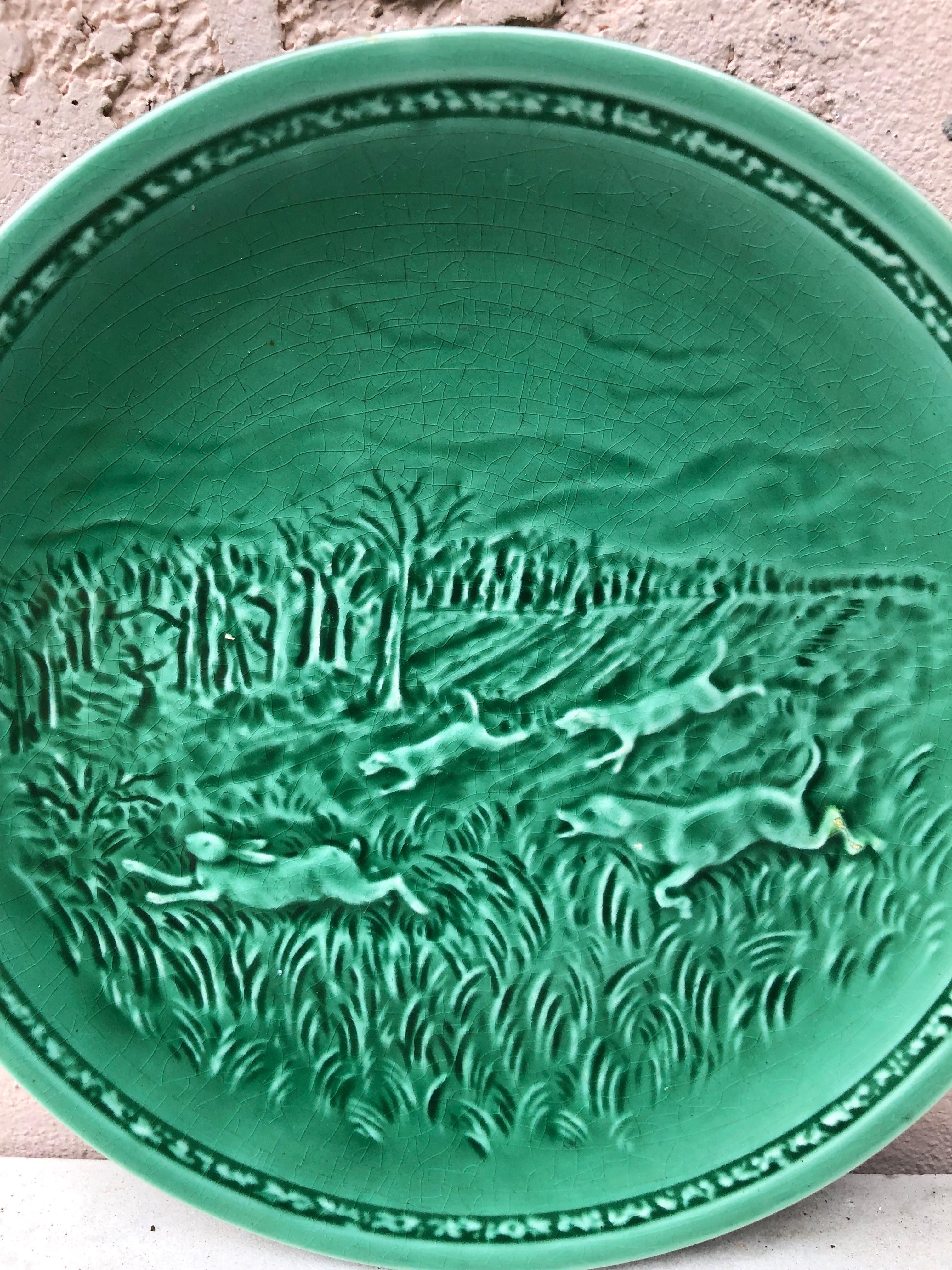 French green Majolica hare and hunting dog plate signed Sarreguemines, circa 1920.
2 plates available.