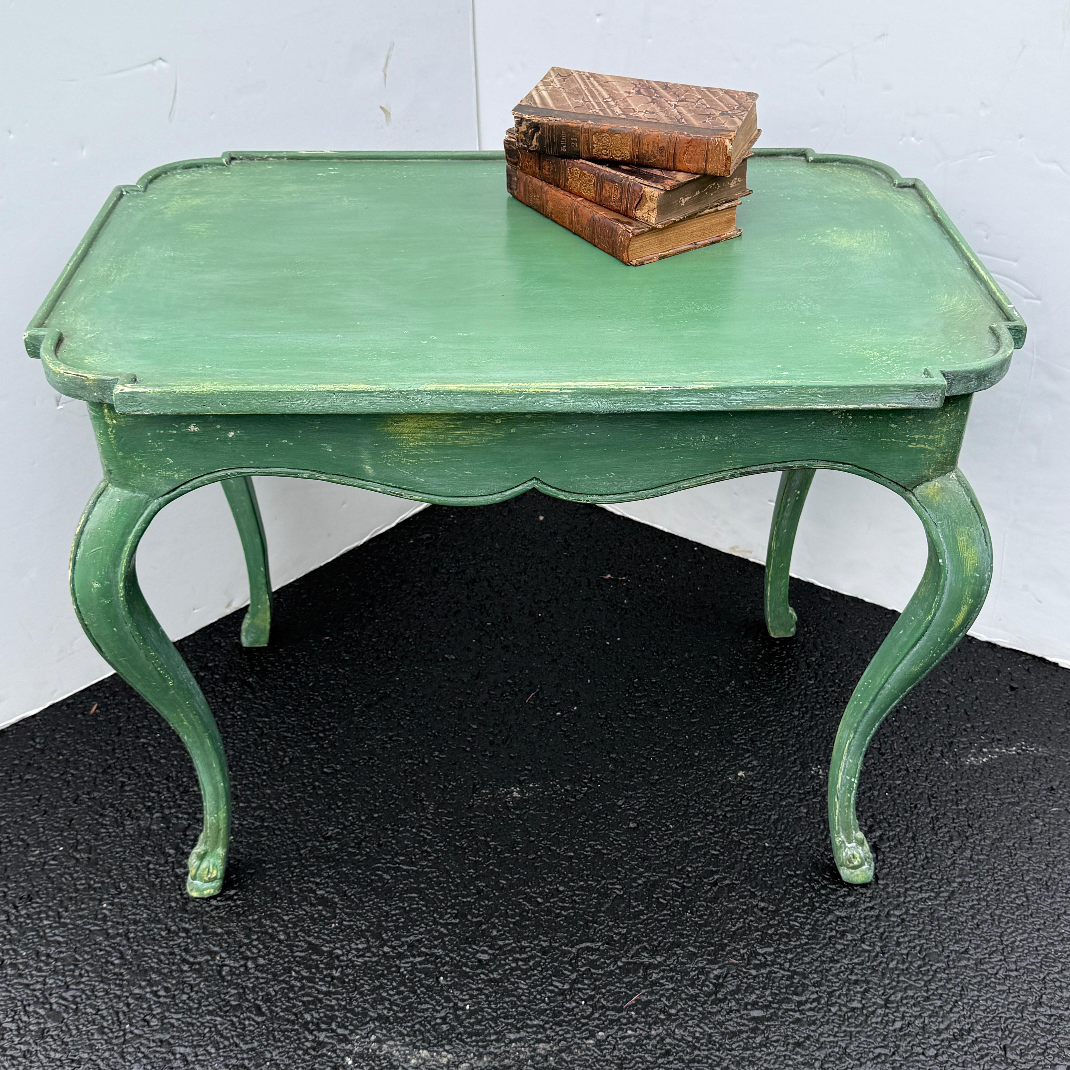 This French hand painted table in a fantastic shade of green. This occasional table certainly brings charm to any formal or informal home setting either in a foyer, hallway, living room or bedroom setting.
