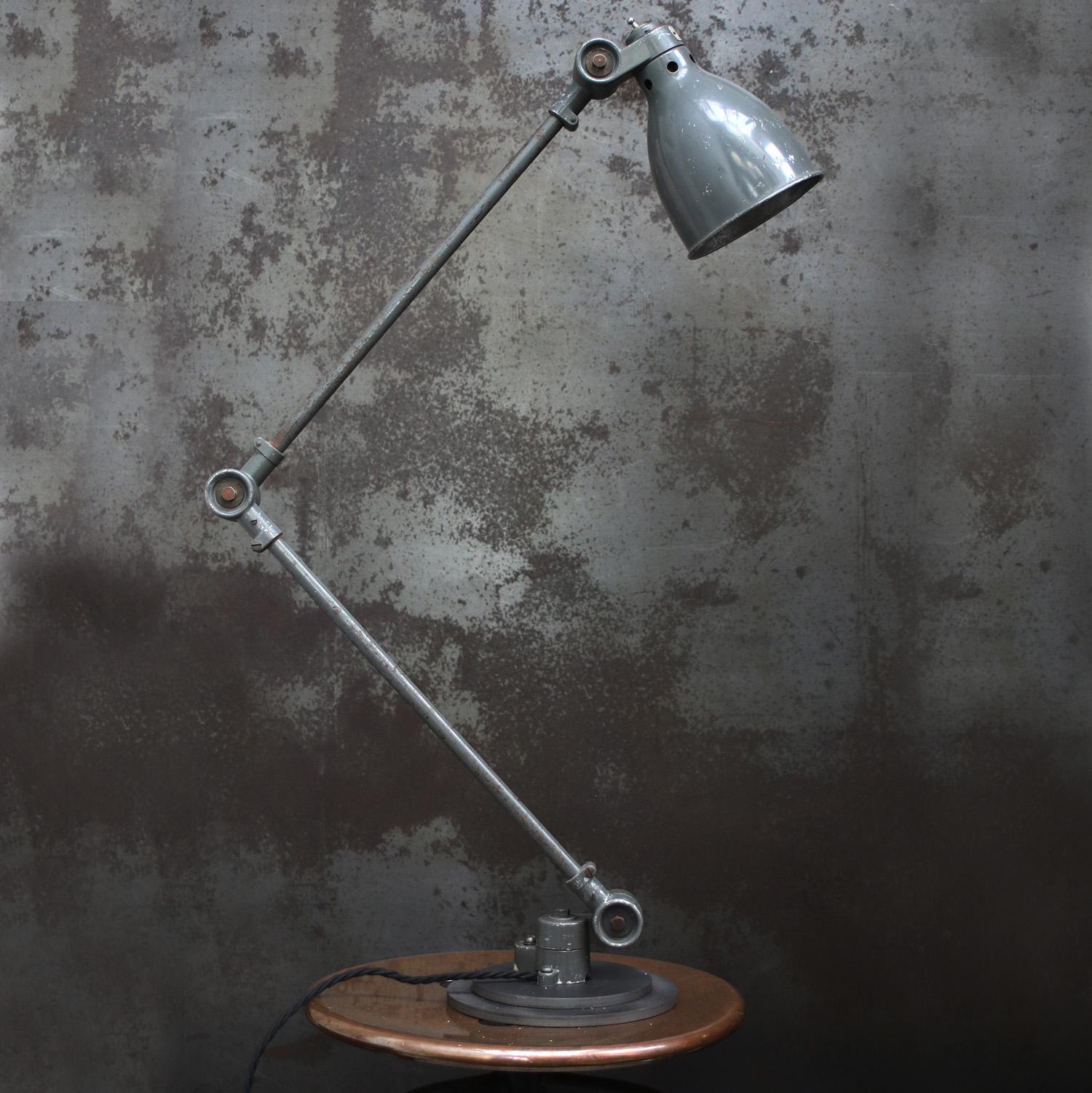 French grey metal machinist work light by SANFIL J.L. PARIS.
Adjustable in height and angle.
Including plug and switch in shade.

Available with UK / US plug

Weight: 3.90 kg / 8.6 lb

Priced per individual item. All lamps have been made suitable by
