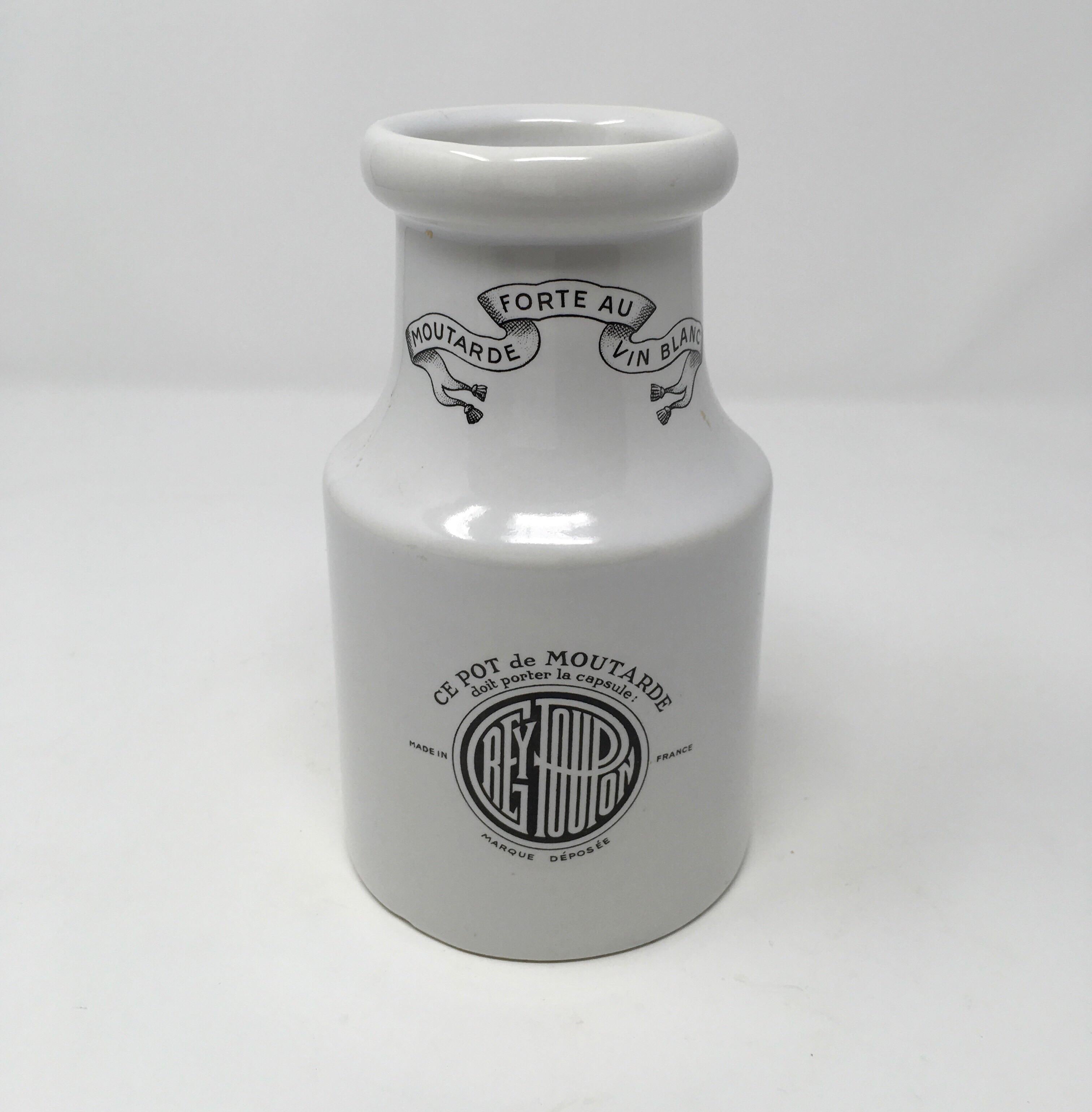 Found in the South of France, this vintage stoneware Digon Grey-Poupon mustard pot will add charm to your kitchen and would be a great addition to any stoneware collection. This pot has black transfers on both the front and reverse side and is
