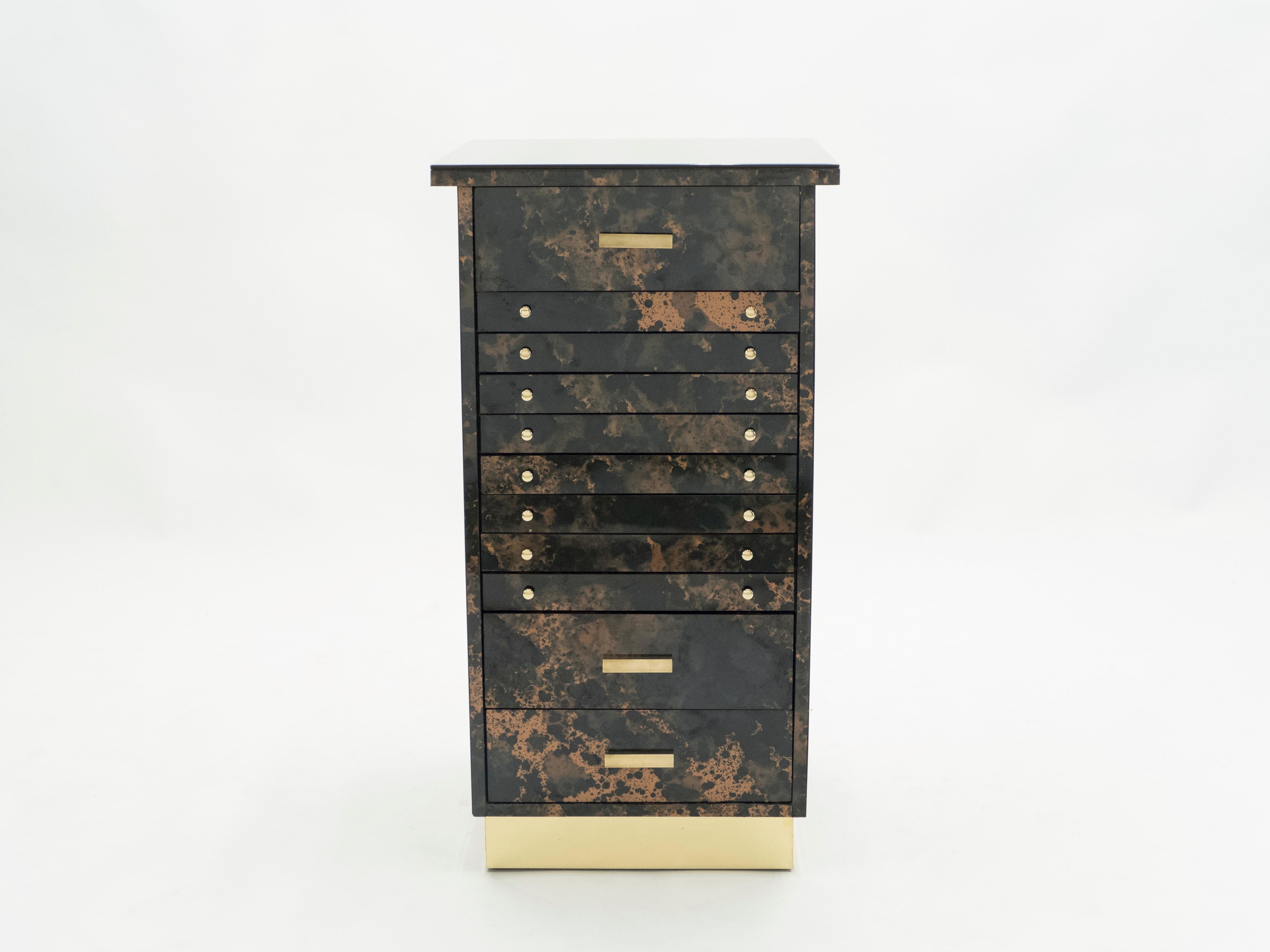 A rare and beautiful cabinet dresser by Guy Lefevre from the 1970s. Rich lacquered in shades of bronze with brass handles and details balance the best of Mid-Century Modern design with a contemporary look, having a warm, inviting feel. It was an