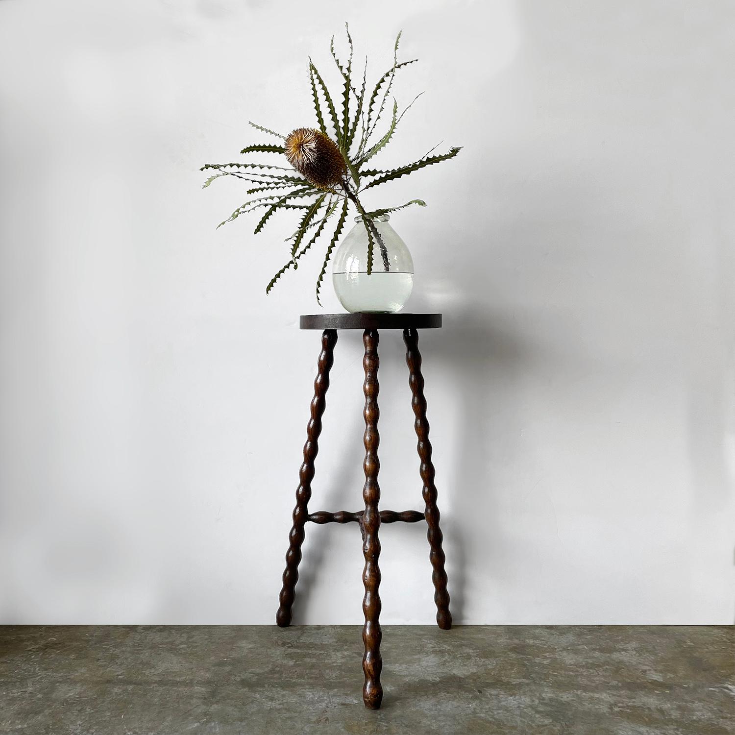 French half moon tripod stool
France, midcentury
Can be used as a stool or side table
Half moon seat with whimsical turned wood tripod legs
Original wood finish with lovely grain detail
Patina from age and use
This listing is for a single