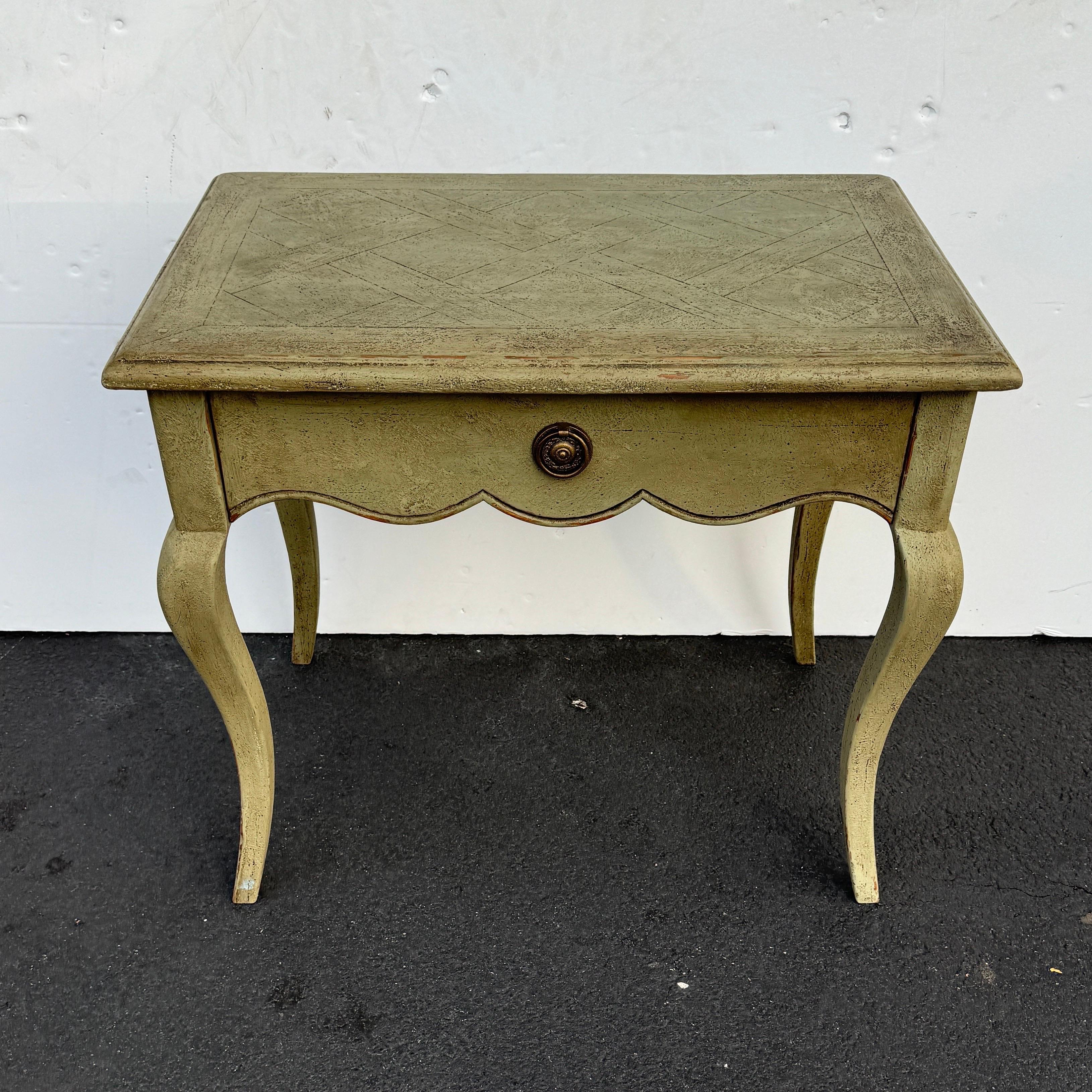 Hand Painted Hall, End or Occasional Table with parquetry patterned top from France. This distressed painted wood side table with one drawer, cabriole legs and scalloping features a warm and muted green color. The clean lines and elegance of this