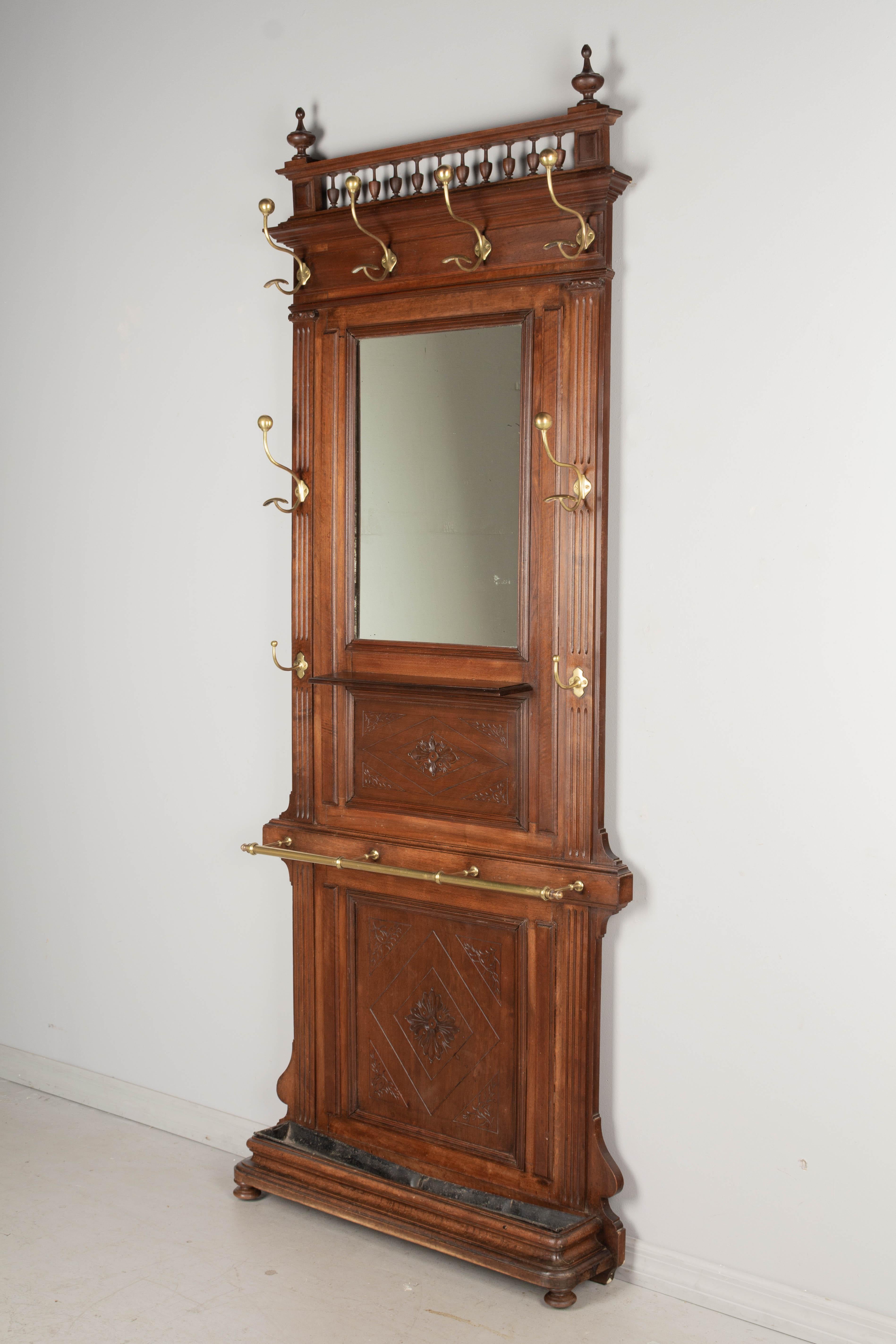 antique hall tree with mirror and marble