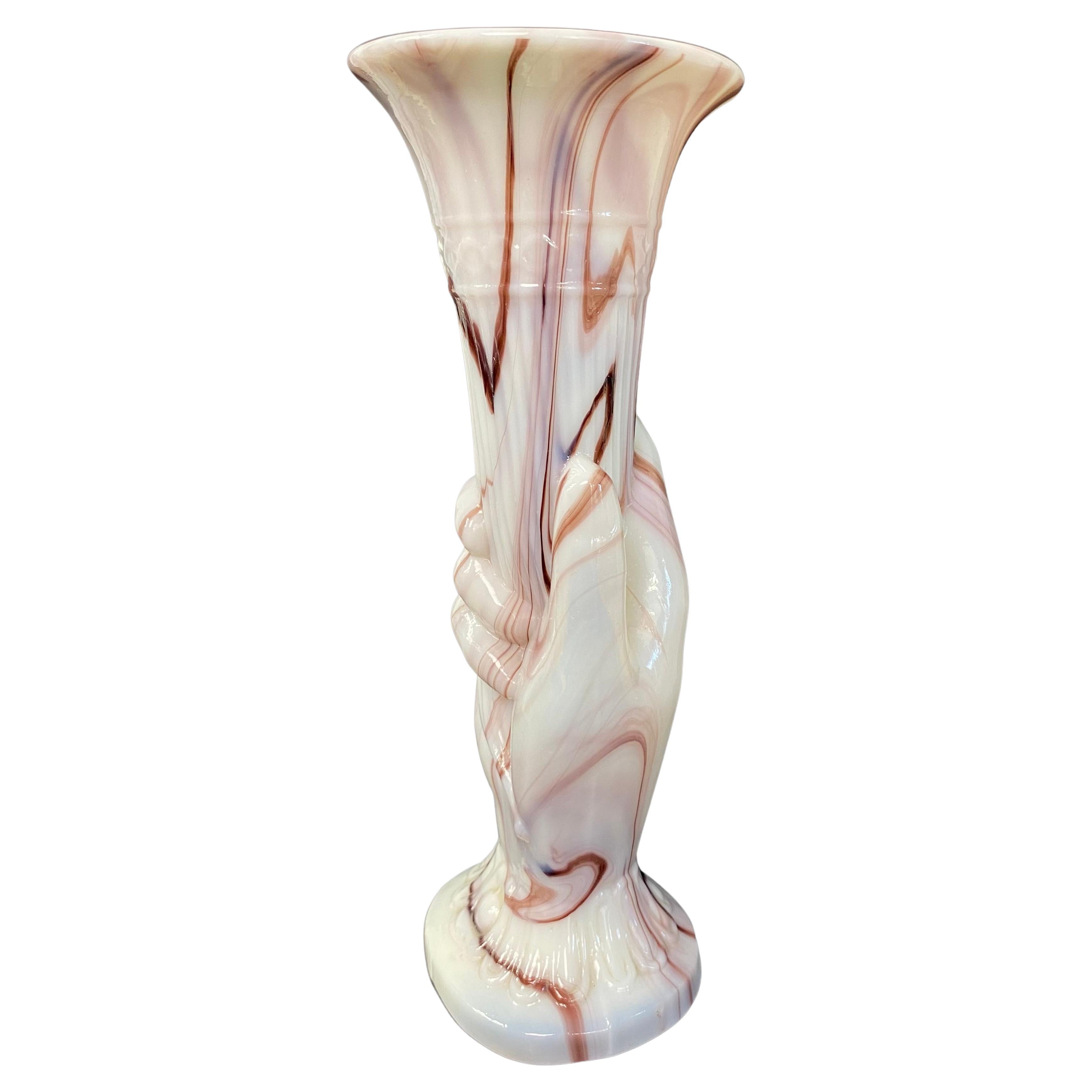 Blown white and brown opaline vase from the Portieux Vallerysthal crystal factory representing a hand holding a cornucopia and dating approximately from the 1920s
“Cornet” vase or “Main” vase
The ring finger wears a ring and the base represents the