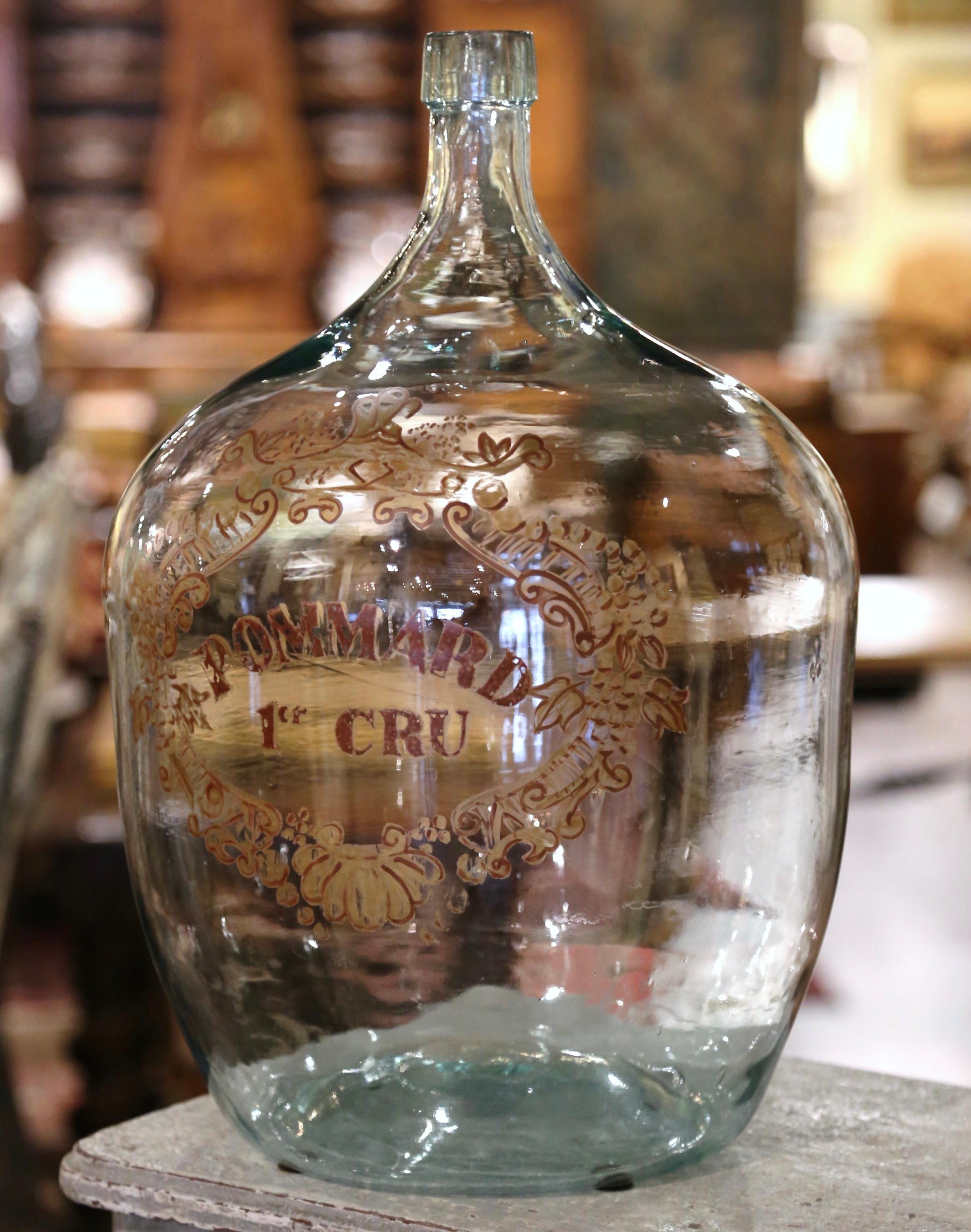 Store your wine corks in this Classic French wine bottle! Hand blown in France, this tall glass bottle features a hand painted family crest with the following words 