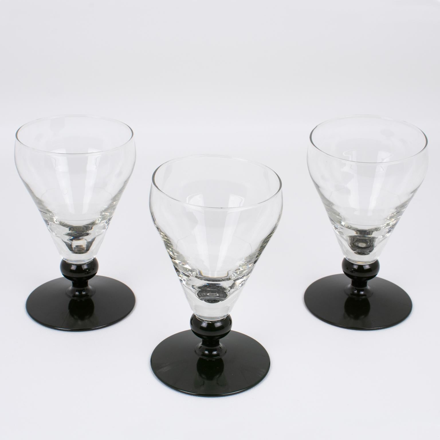 This is an authentic set of three French Absinthe glasses manufactured by Franckhauser in Lyon circa 1910. 
French bistros, bars, and cafes used these heavy glasses in the ritual of drinking the addictive beverage called 