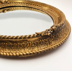 Französischer handgeschnitzter vergoldeter Ovalspiegel um 1855