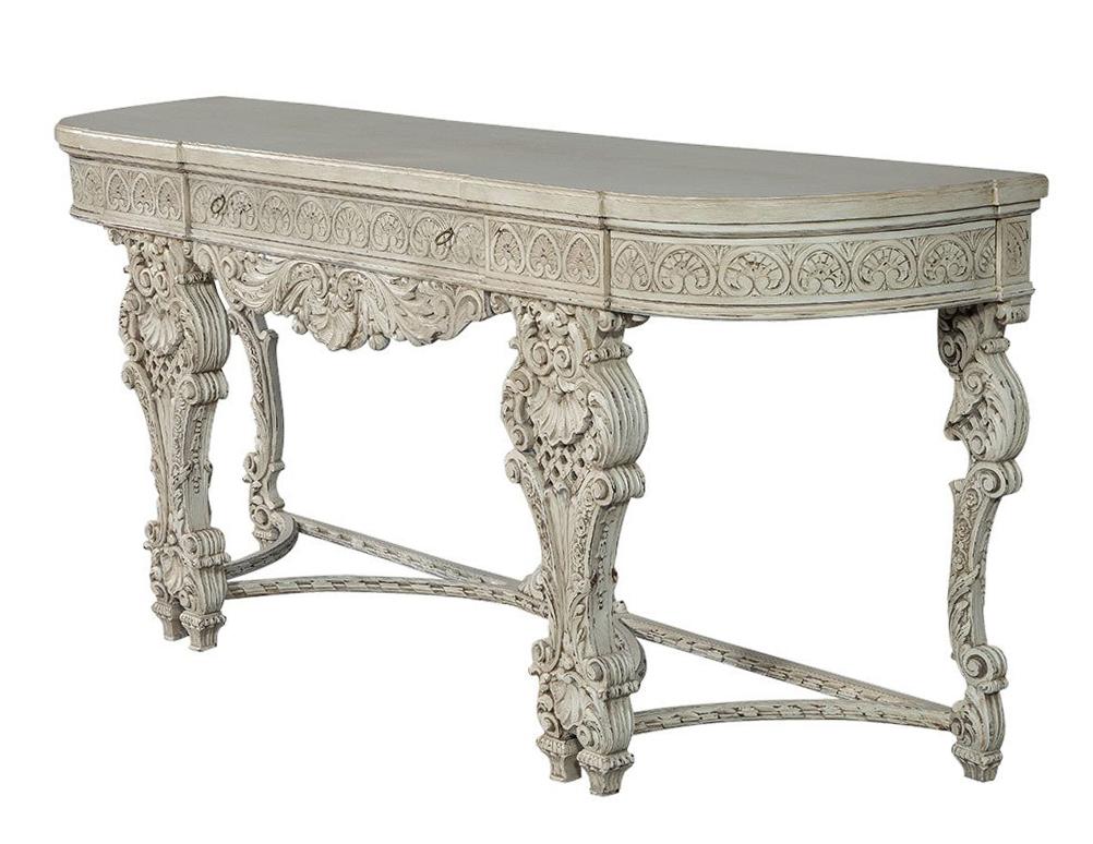 A gorgeous hand carved console from the Carrocel Original collection, replete in Rococo extravagance. A flat front with one central drawer, and convex sides with hidden compartments, feature carved scrolls and whorls. The intricately carved apron