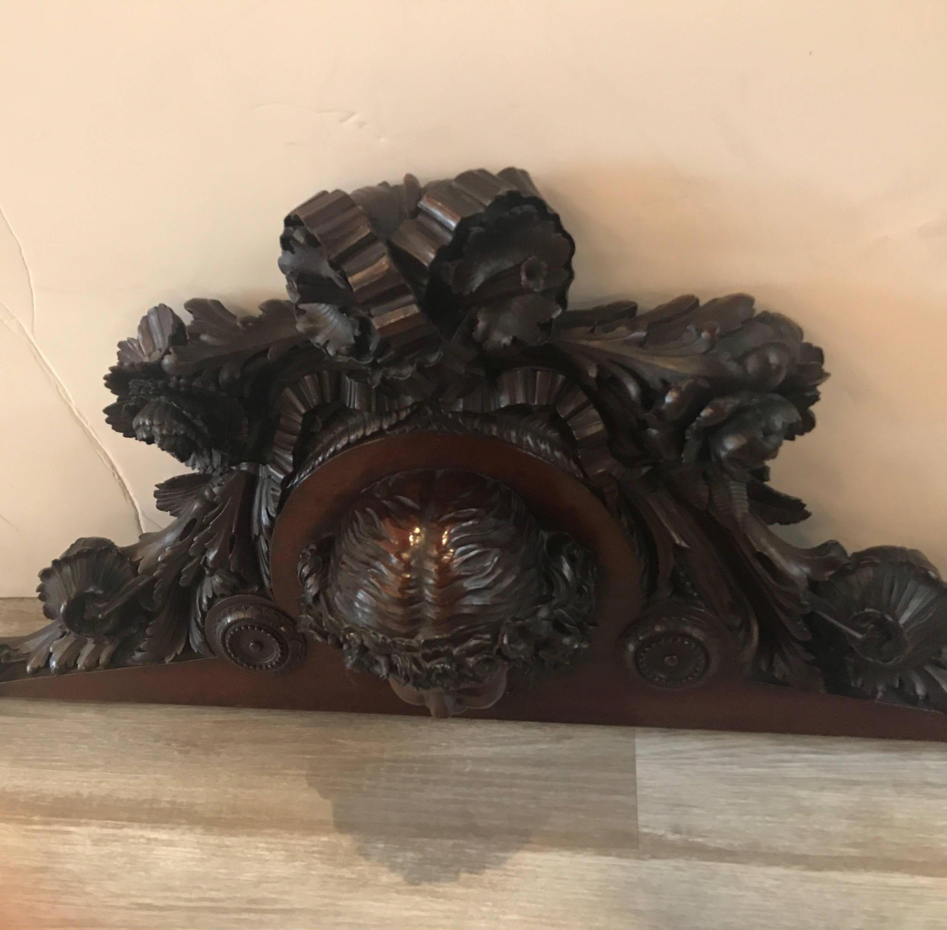 A wonderfully carved wall plaque with highly detailed female figure surrounded by ribbons and floral decoration,
France, circa 1860. This displays beautifully over a doorway or above a mirror.
