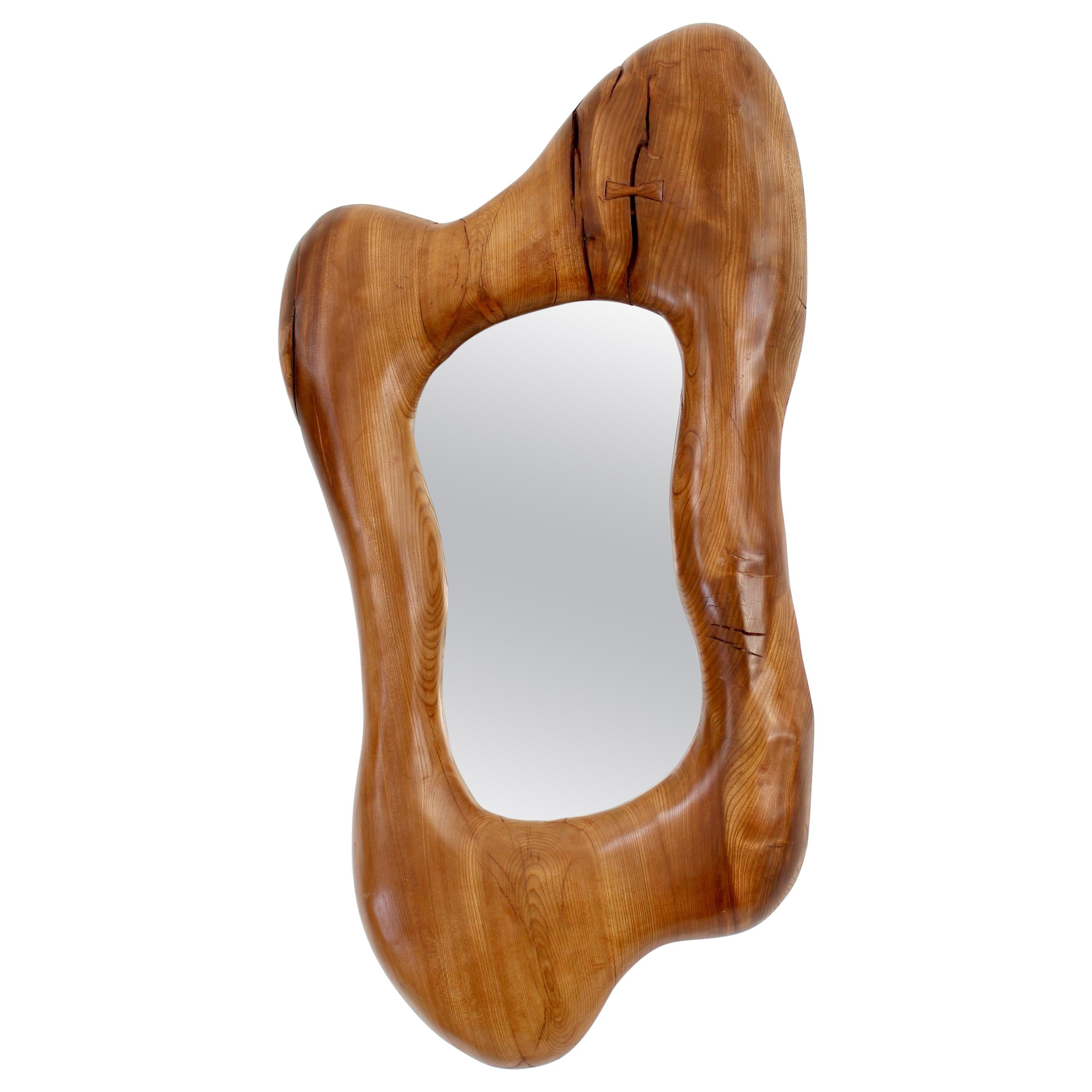 A contemporary hand carved organic modern large wall mirror in French elmwood with a beautiful butterfly closure and wonderful patina in the spirit of Alexandre Noll and Nakashima.
Overall size: 19