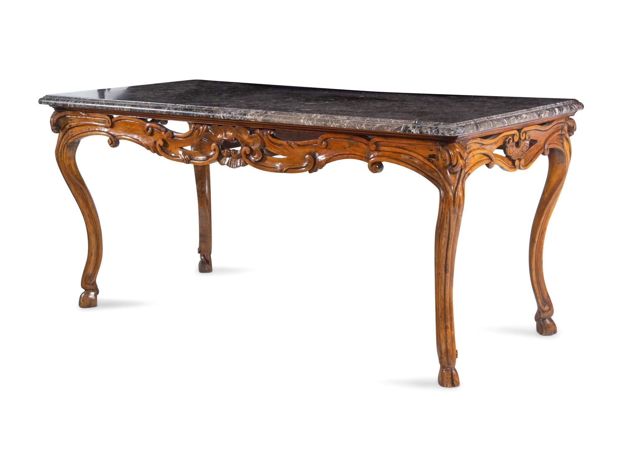 Hand carved walnut console with marble top. Made in France, 18th Century.
Dimensions: 
37