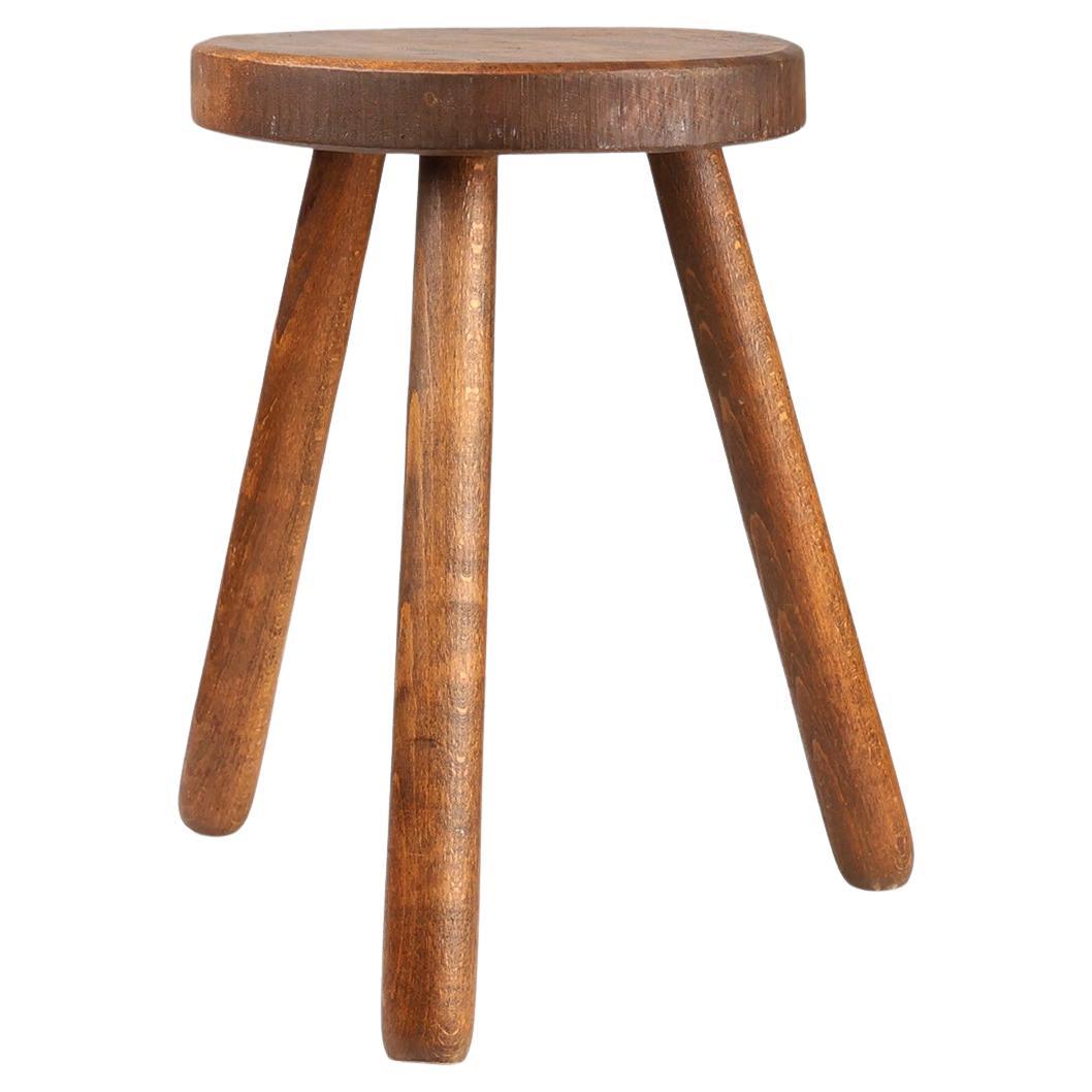 French hand crafted brutalist rustic low tripod stool in solid wood