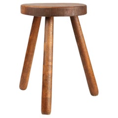 French hand crafted brutalist rustic low tripod stool in solid wood