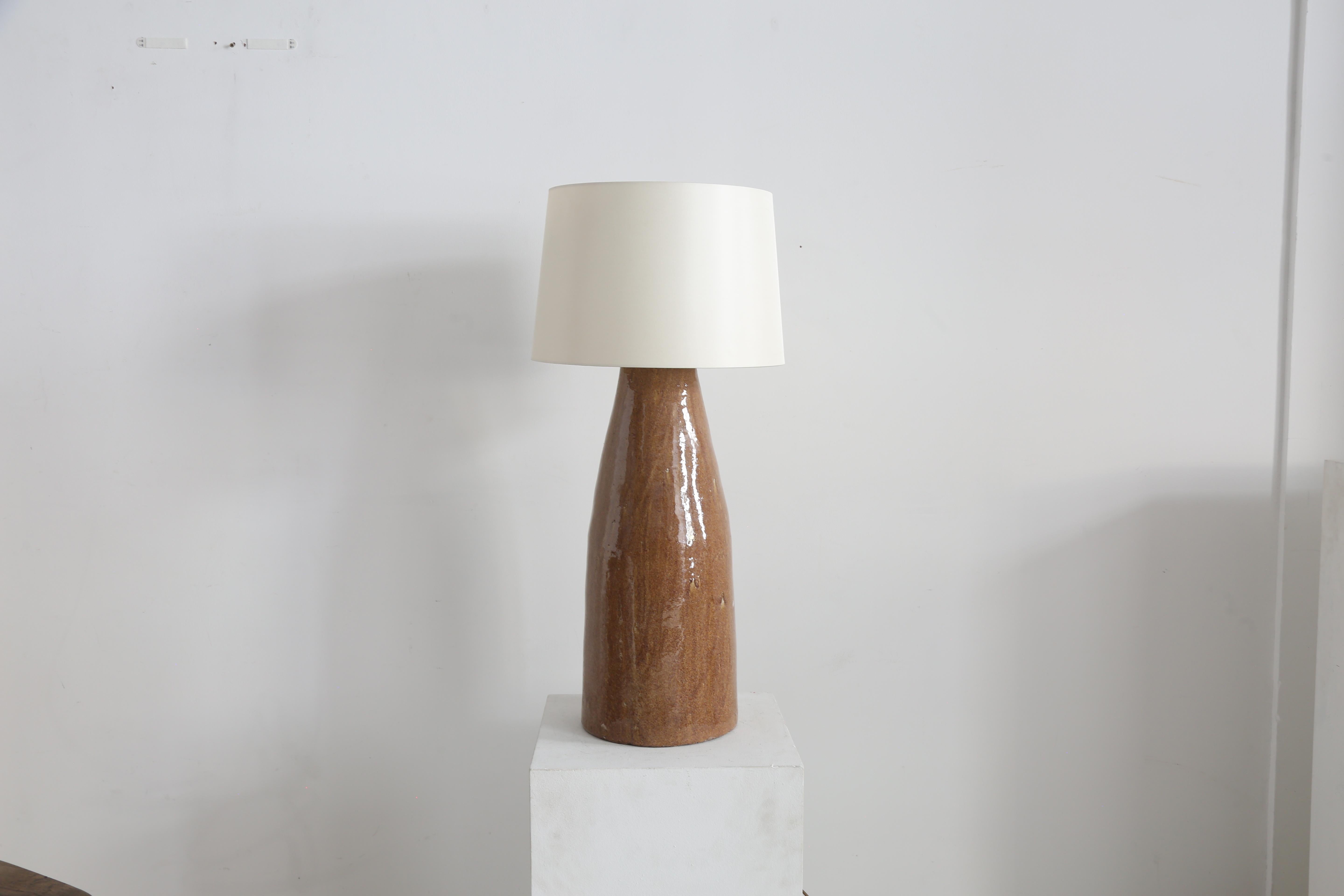 Heavy set oversized hand crafted ceramic lamp. 

Opalescent earthy tone glaze throughout. 

France 1970s.

H 63cm x D 26cm (without shade)
