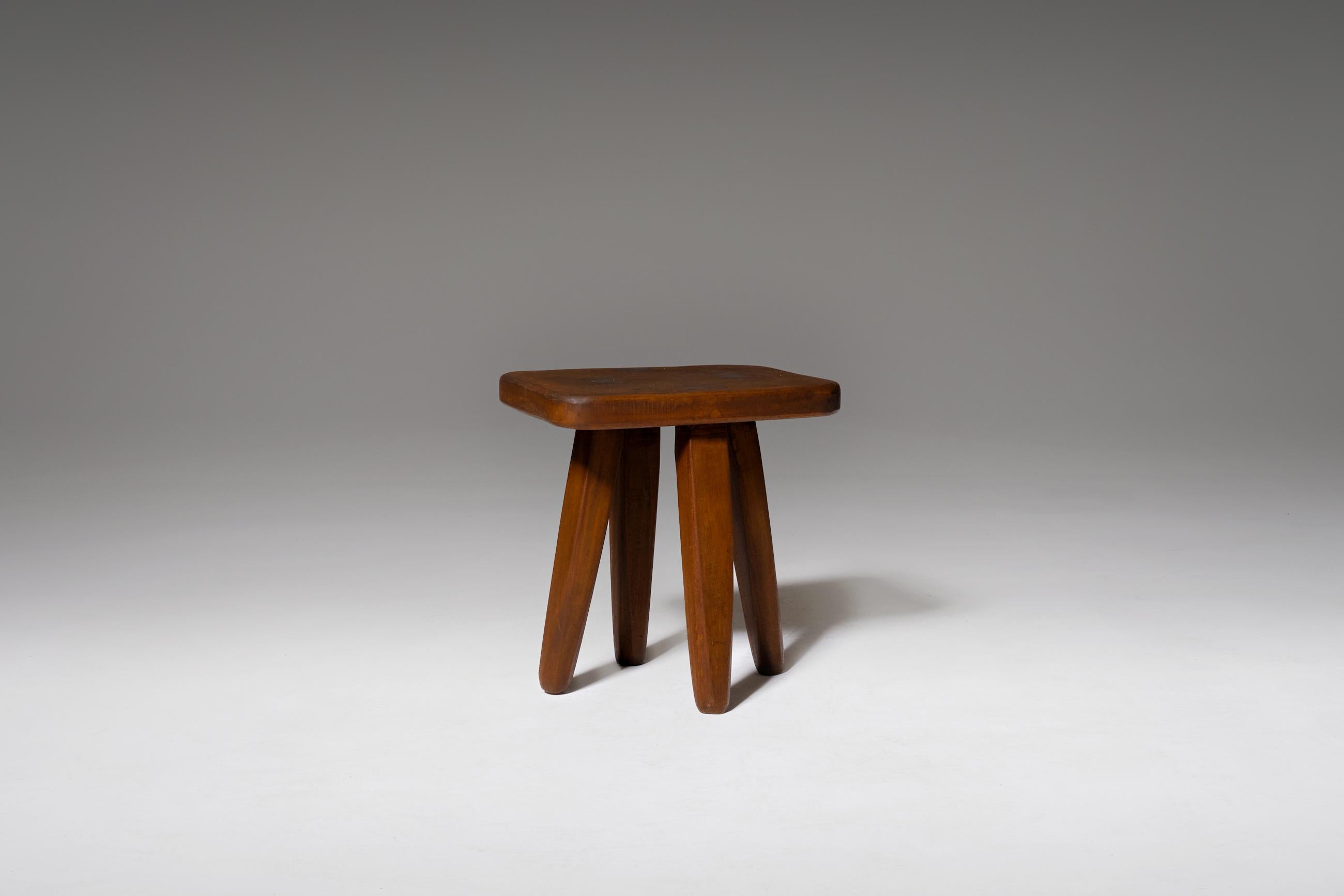 Large French wooden stool, 1960s. Simple and elegant design hand crafted from tropical hardwood. Nice details such as the cut out leg construction, there where the legs comes true the top of the stool. Very stable and solid object. Can be used as a