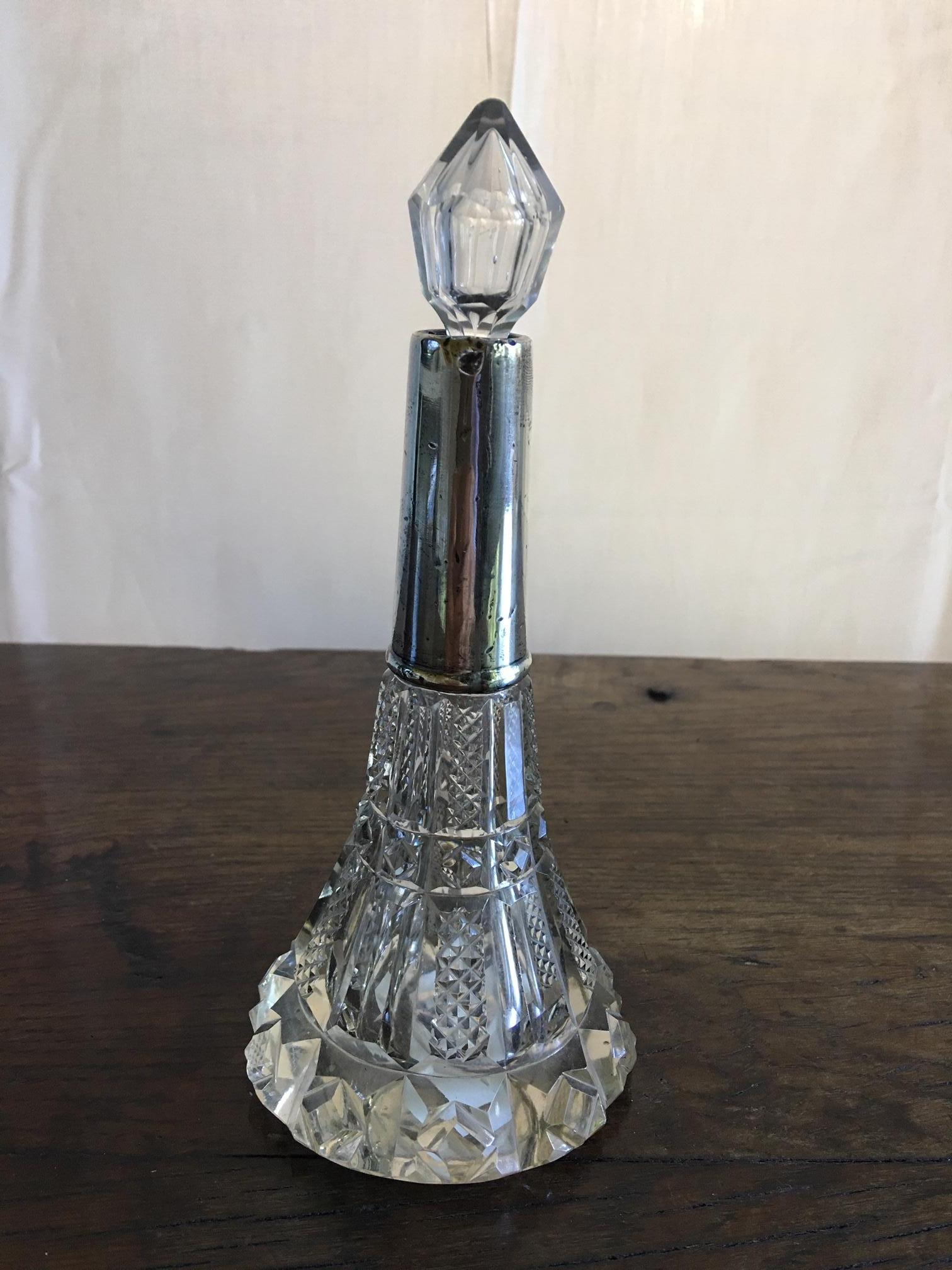 French handcut crystal perfume bottle with a sterling silver top, early 20th century.