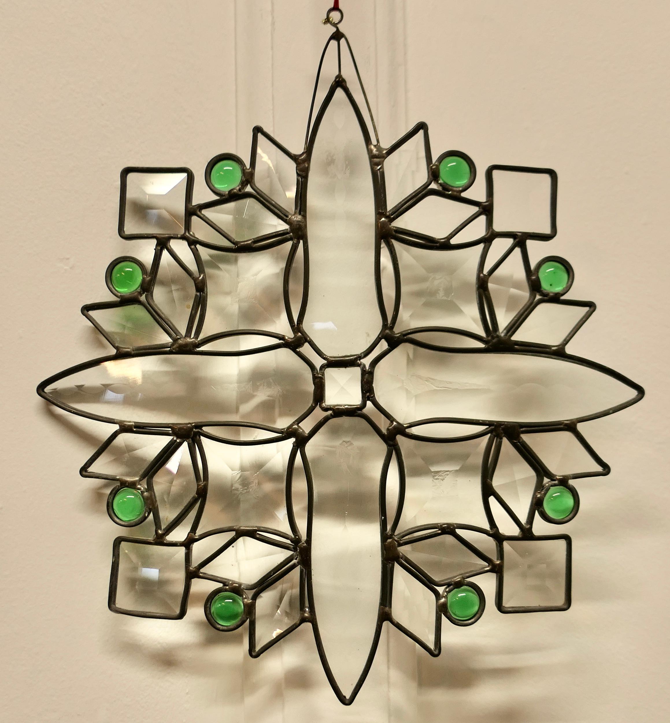 French Hand Made Antique Stained Glass Window Panel

This lovely Artisan made piece has been made from 19th century Jewel Etched  and Faceted Glass, skilfully set to make a star shaped pattern
The Panel is a one off, there is only one like this one,