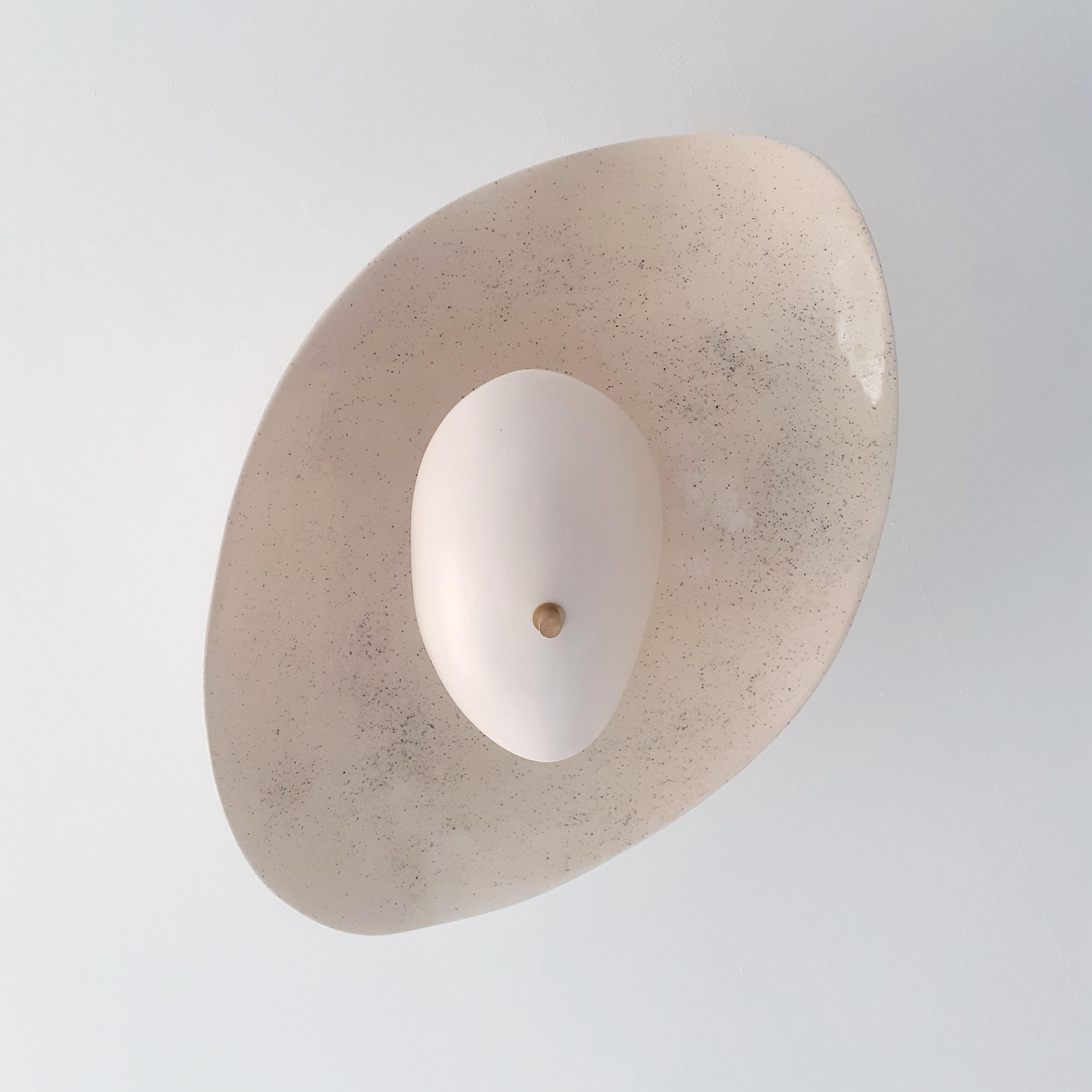 Ceramic ceiling light with airy design.
Brass structure and enameled ceramic handmade in Parisian worksop by Elsa Foulon Studio.
Custom-made on request.