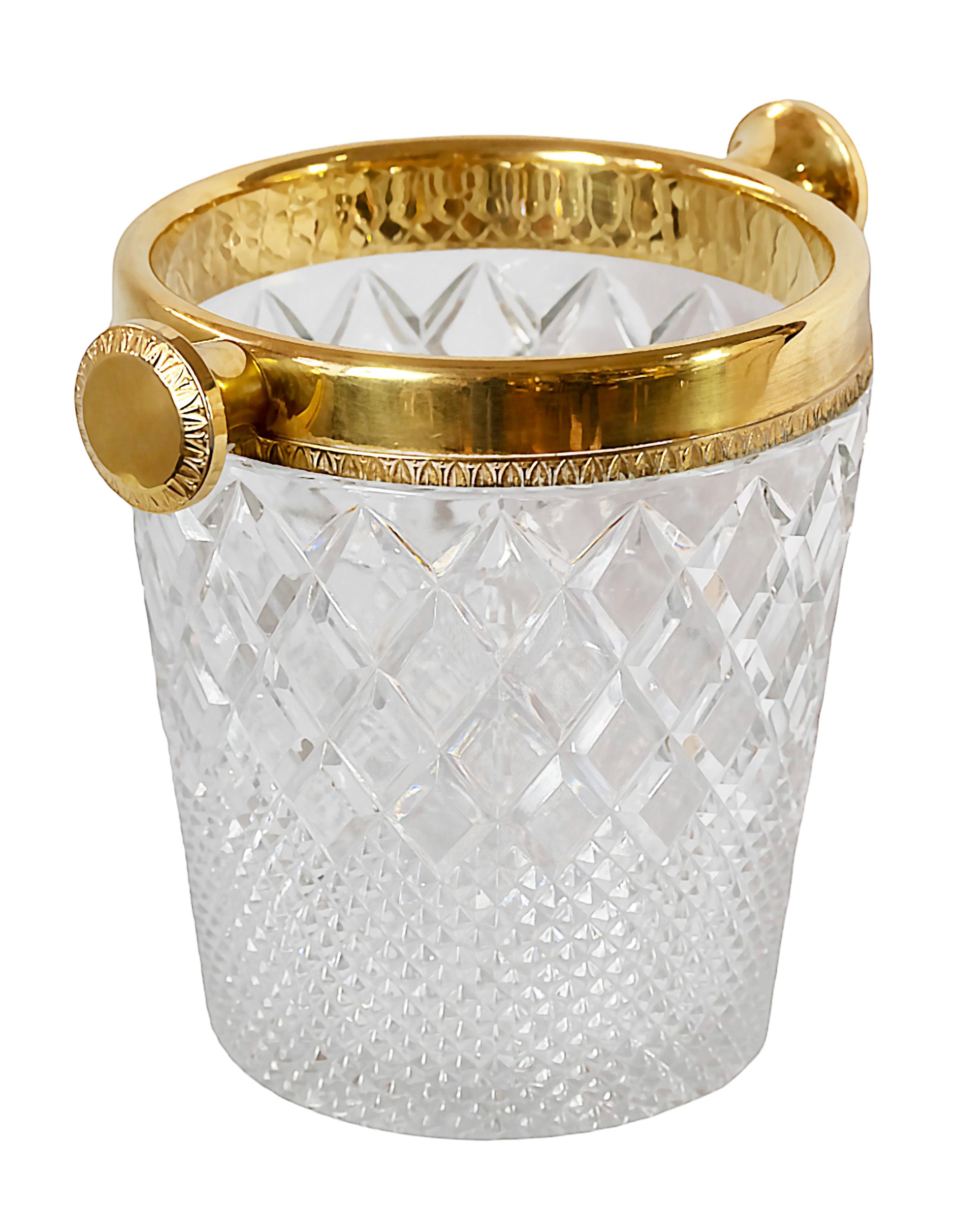 Vintage French hand made cut crystal champagne bucket decorated with gilt metal and handles.
Very heavy and solid.