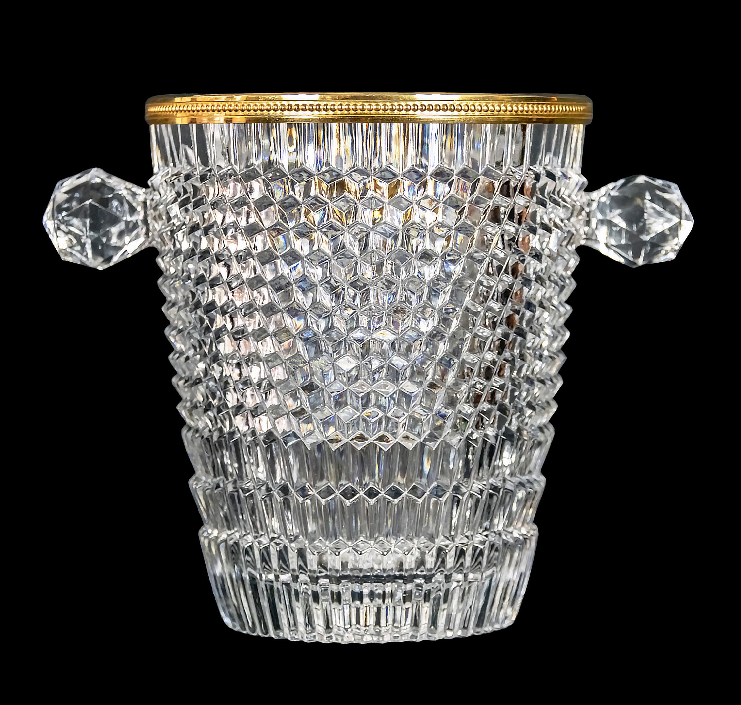 Vintage French hand made cut crystal champagne bucket with handles decorated with gilt metal trim.

