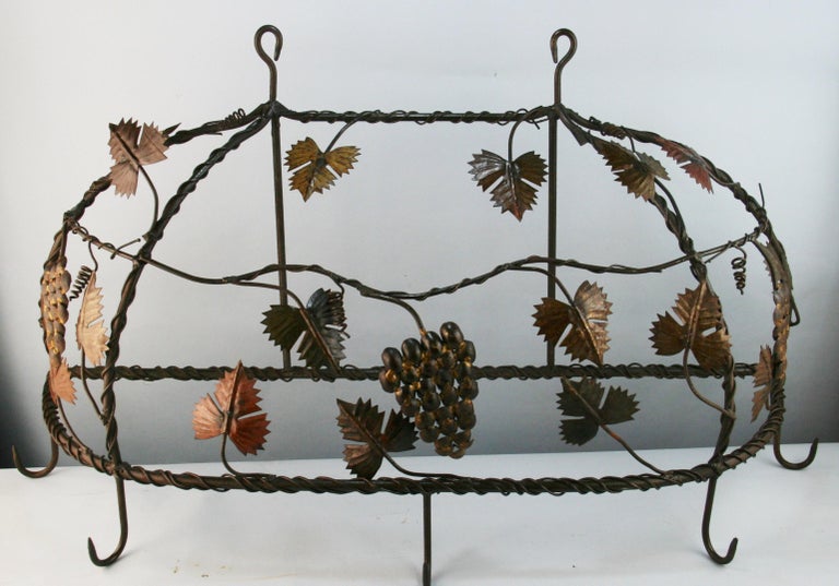 French hand made five hook rack with leaves and grapes details.