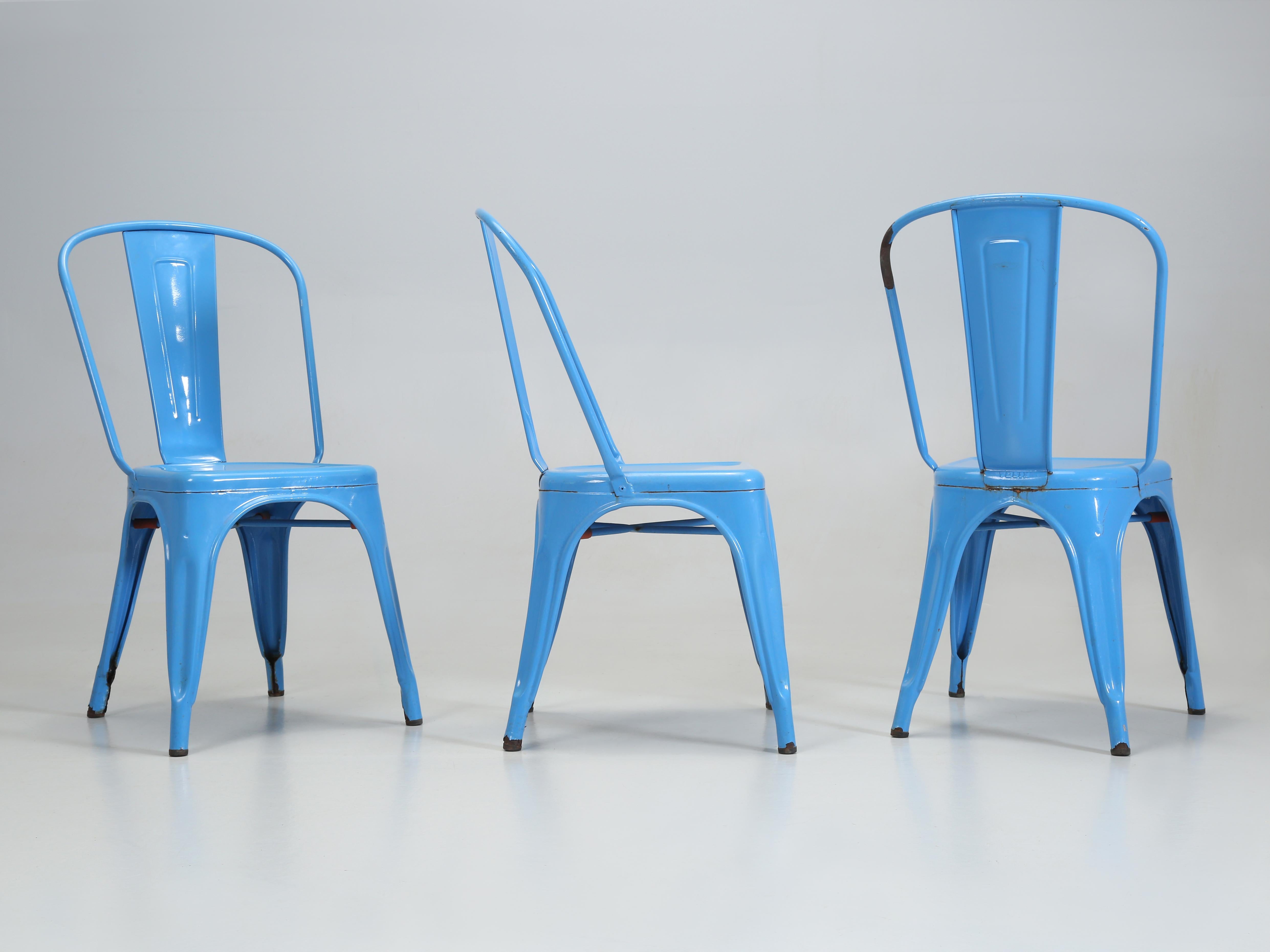 Genuine Vintage French Hand-Made Steel Stacking Chairs by Tolix. The Set of Tolix includes (4) Vintage Blue Steel Stacking chairs in a distressed look. Currently, we are stocking over (1300) pieces of Genuine Tolix Chairs, Tables and Tolix Stools in