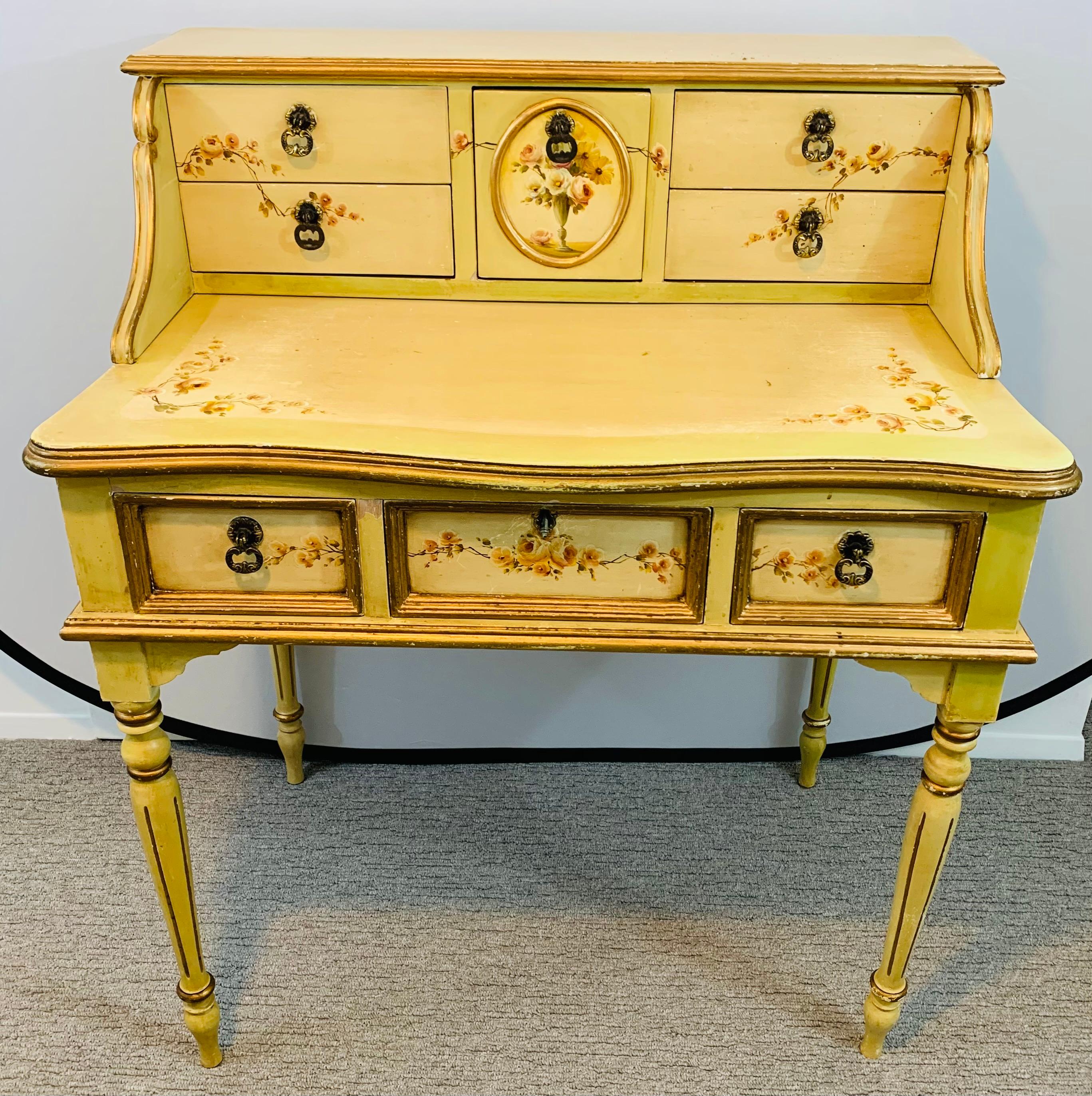 An exquisite hand painted French lady desk with a matching chair. The desk features Fine wood carving, elegant hand painted flower motifs on the front and sides and multiple drawers for storage. The top section has 5 drawers and the lower section