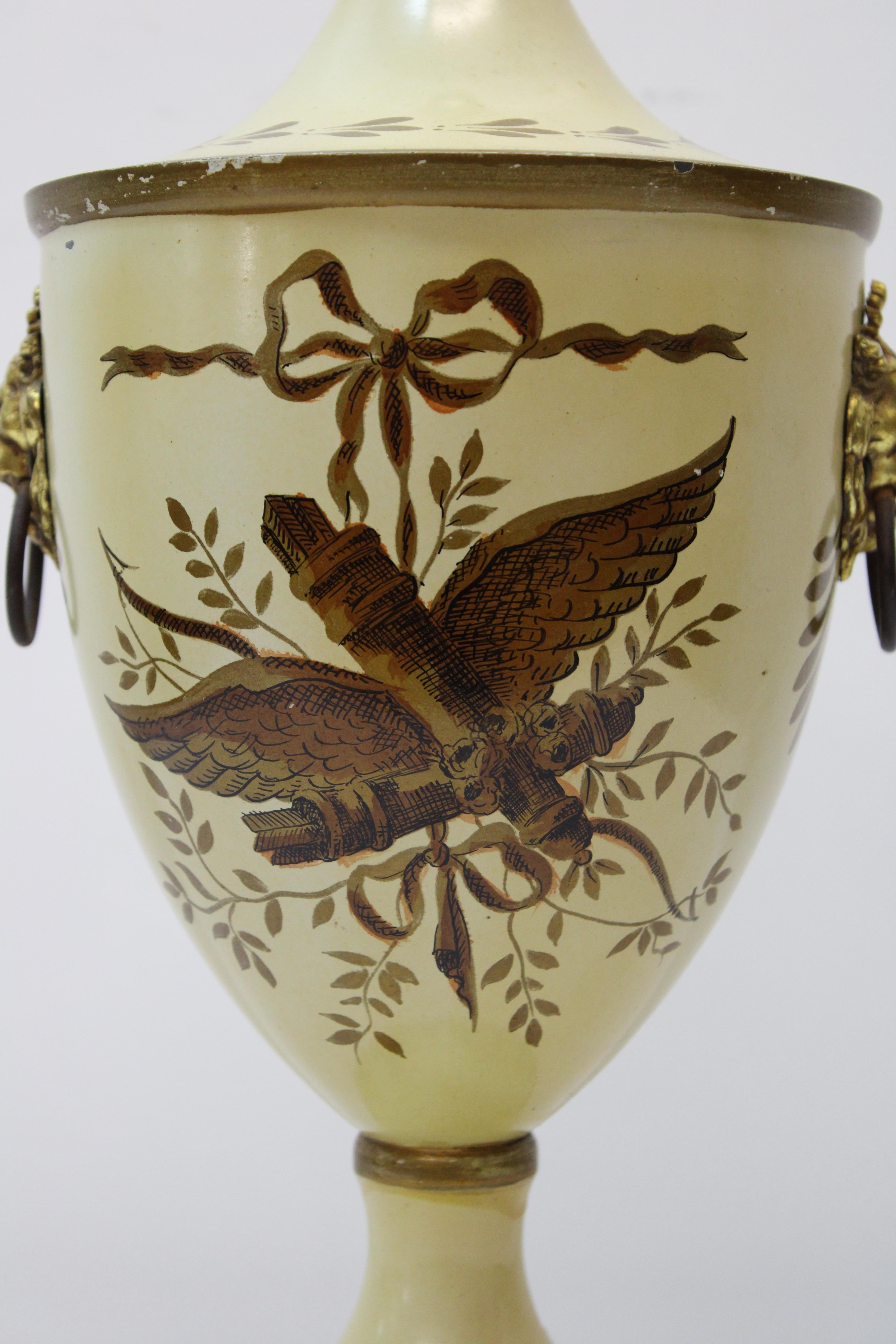 C. 20th century.

French hand painted tole urn w/ brass lion head ring handles.
