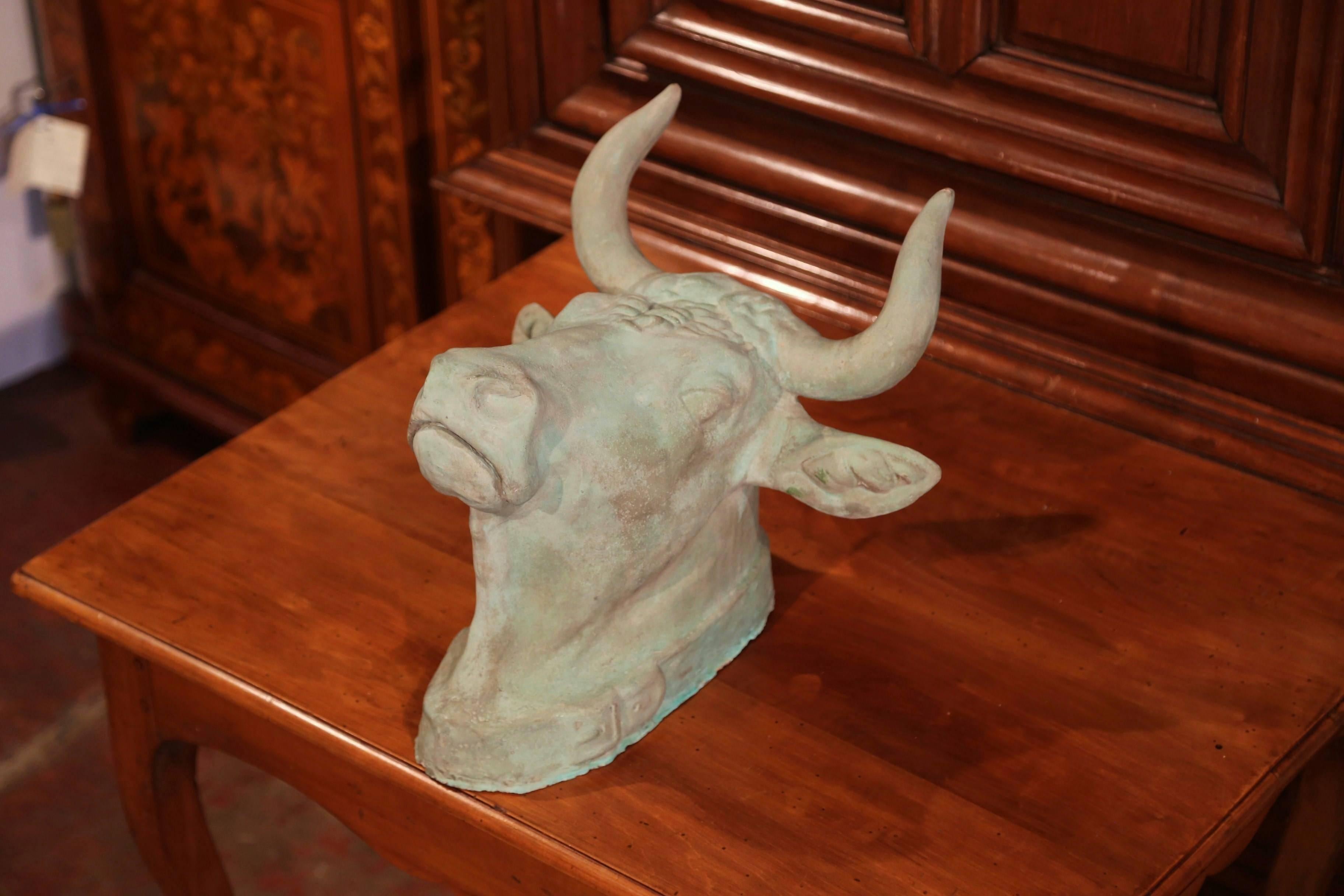 This beautiful cow head was crafted in France after an original zinc model. The hand-carved sculpture is made of terracotta and features a realistic cow head with a collar in relief around the neck. The sculptural butcher sign is in excellent