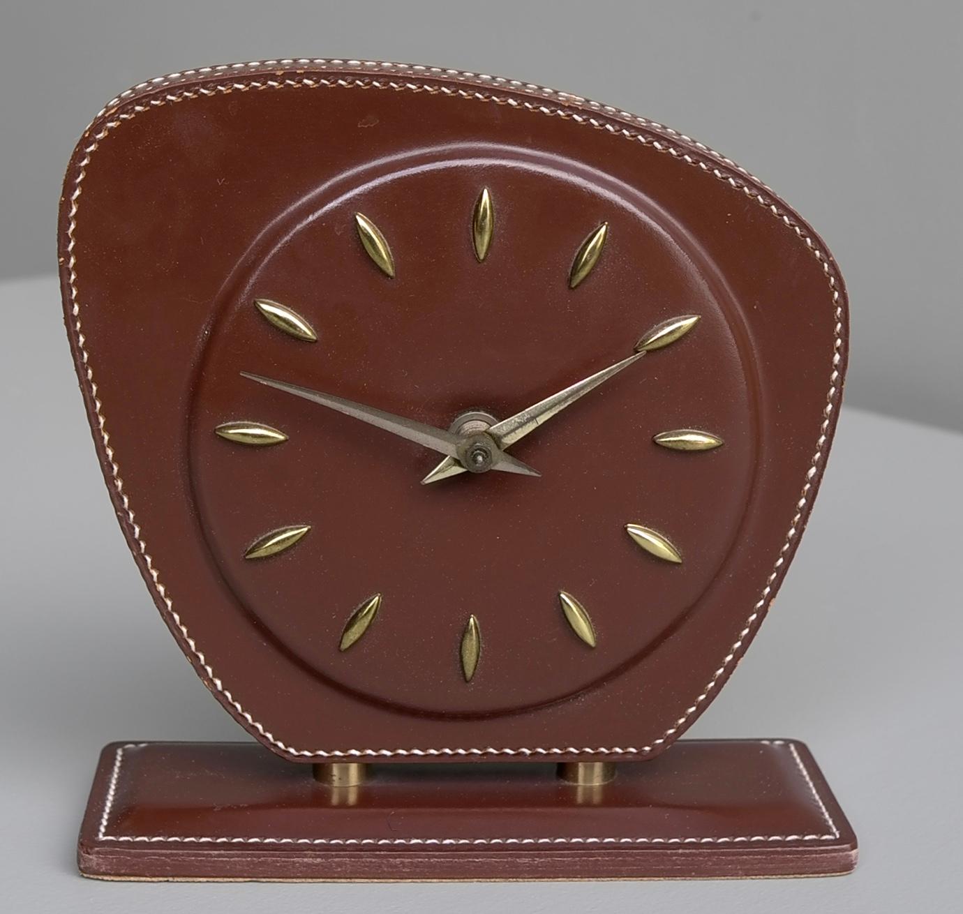 French handstitched brown leather clock, Jacques Adnet attributed, 1950s.