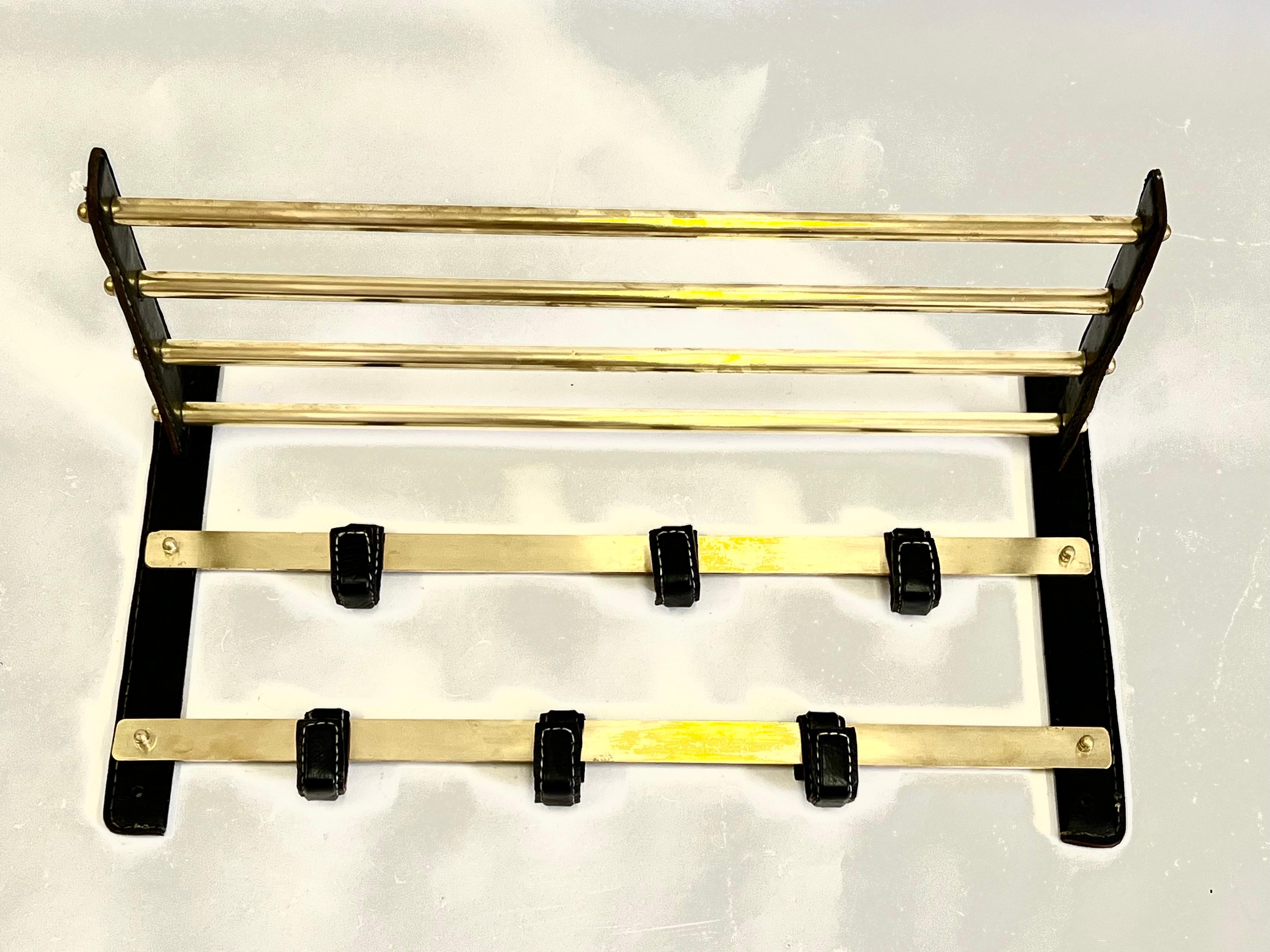 French Hand Stitched Leather & Brass Coat and Hat Rack by Jacques Adnet, 1955  In Good Condition For Sale In New York, NY