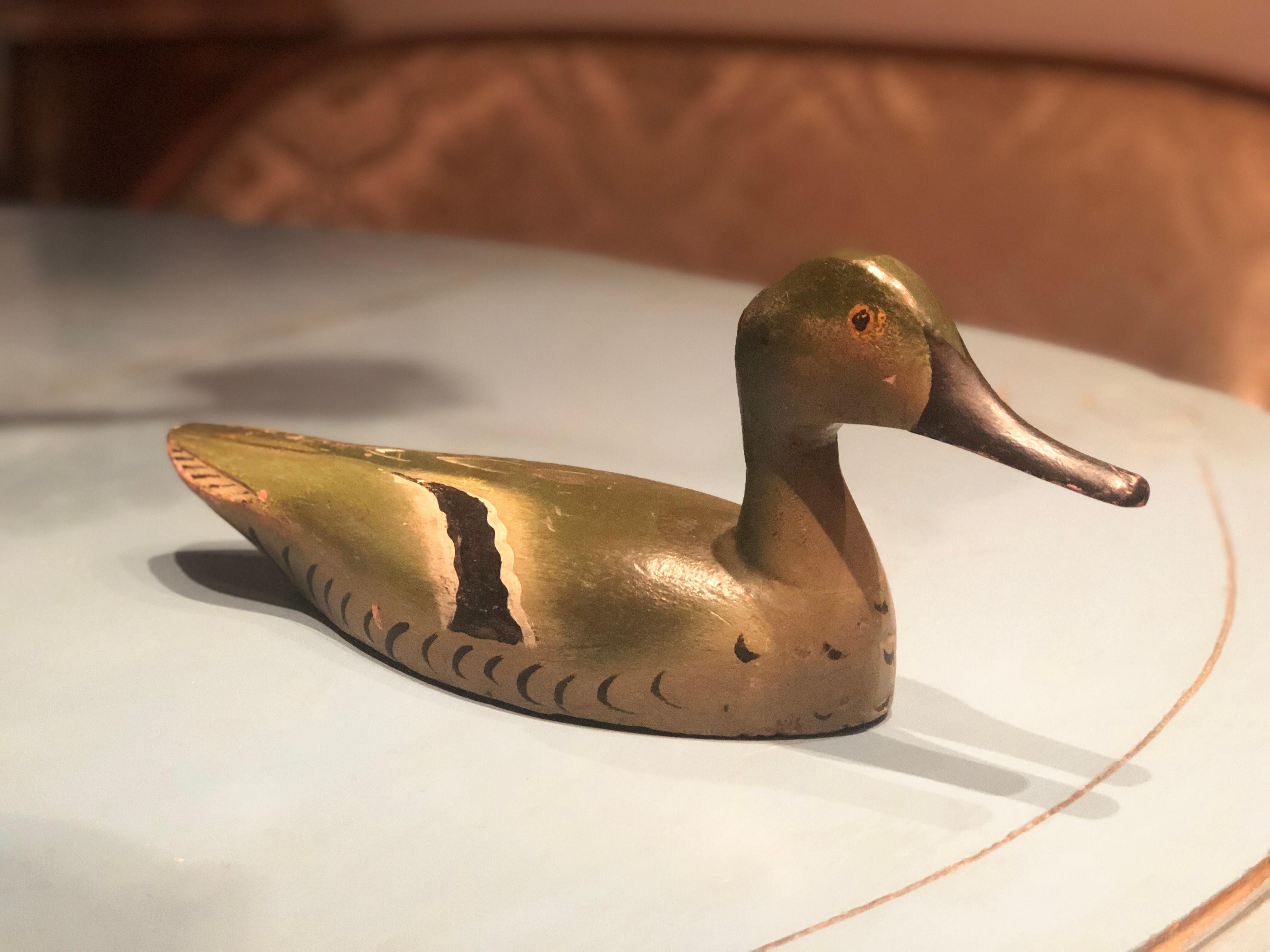 Sculpture of a duck in hand painted wood.
France, circa 1960.