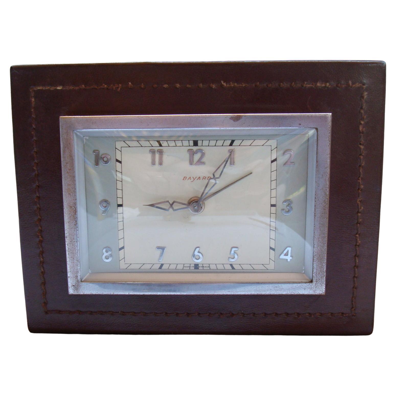 Handsome French Handstitched brown leather desk clock by Bayard. 
Great Restored condition. Keeps good time. Excellent patina. Great vintage condition.
Paul Dupré-Lafon / Adnet Style Leather Clock by Bayard.

 