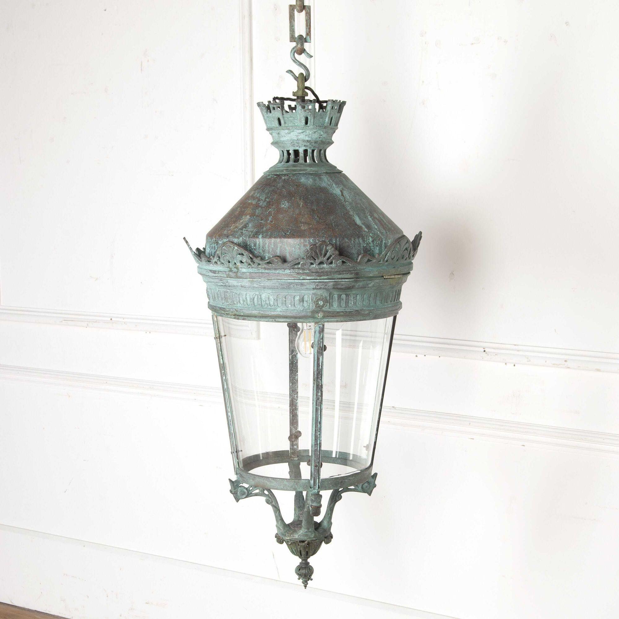 Fantastic 19th century French verdigris copper hanging lantern with chain.
This is a fabulous 19th century French fully glazed convex verdigris lantern, that features a hanging hook above a beautiful-pierced frame with a chain 74 cm. The decorative