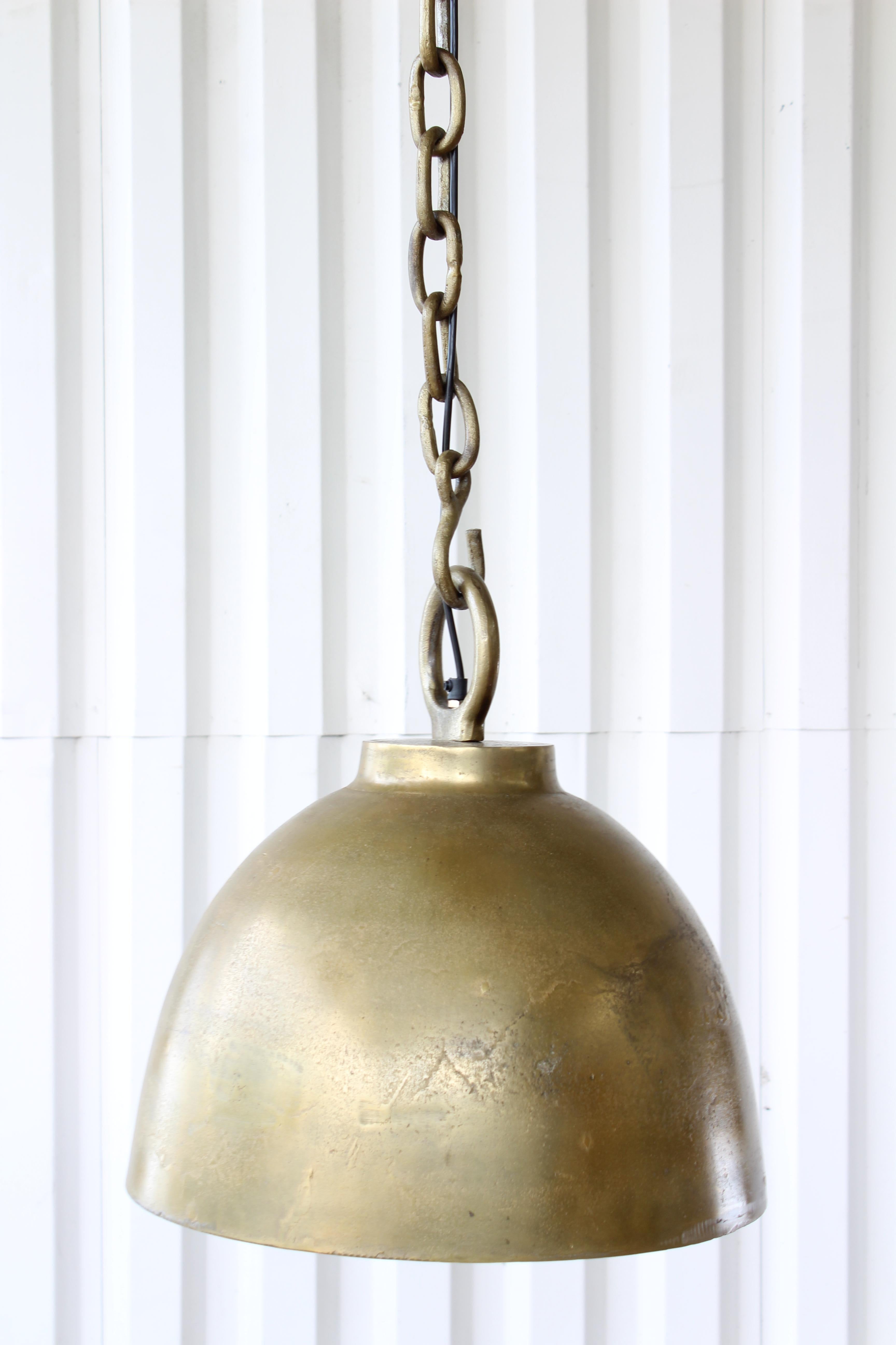 Metal pendant light in antique brass finish. 22 available, each sold individually. Newer production with a vintage look. 62
