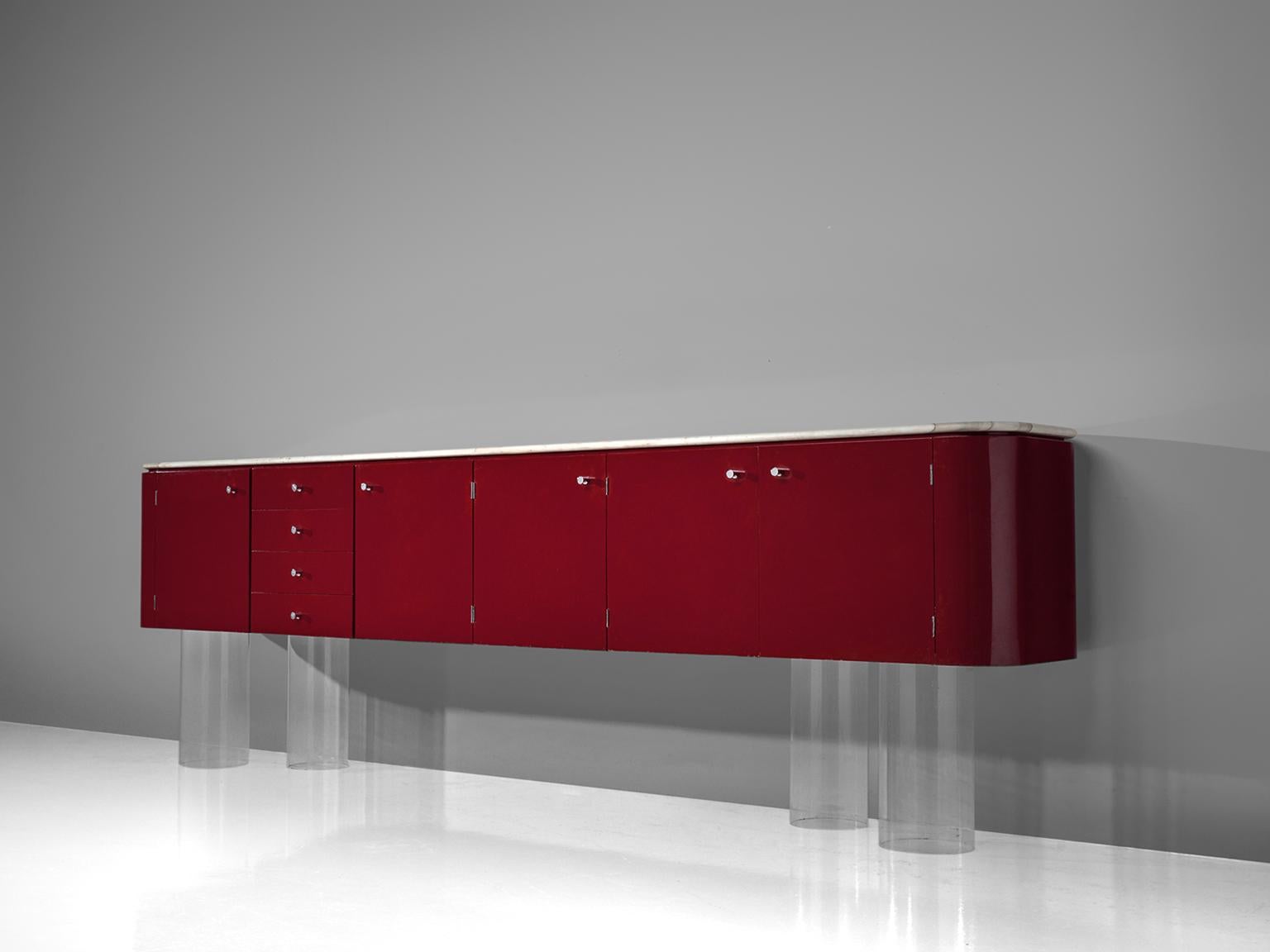 Wall hanging sideboard, lacquered wood and marble, France, 1960s.

This French sideboard is part of our midcentury collection. The large sideboard is lacquered in burgundy-red color and features metal details. The corners are curved which is in