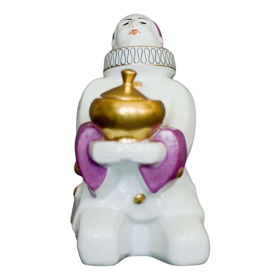 A lovely French Harlequin ceramic ink and pen holder by Aladin. The white ceramic piece features purple and gold accents throughout.