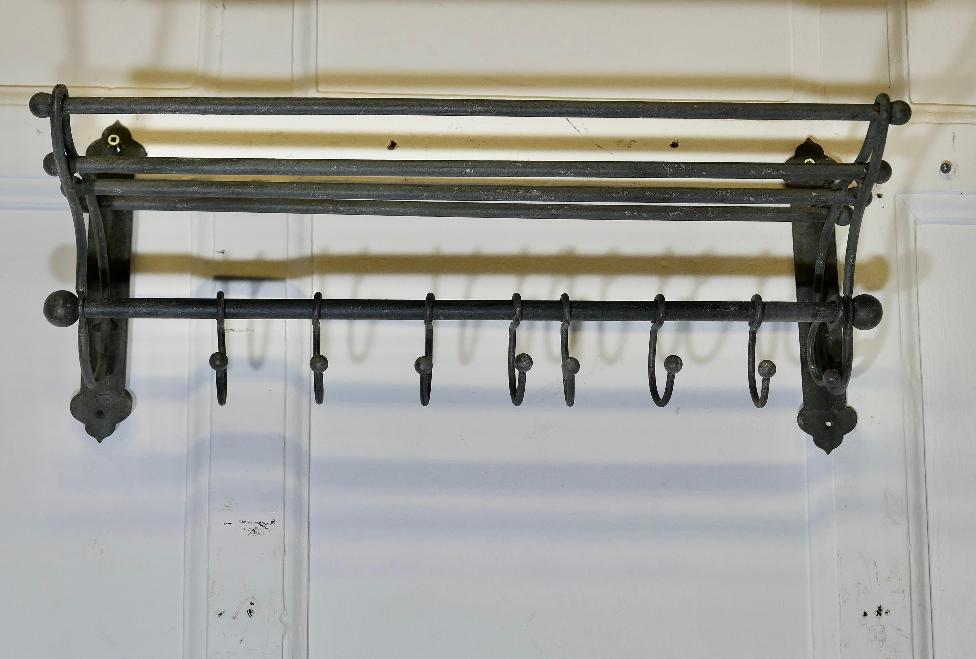 French Hat and Coat Rack 

 This Art Deco style hat and coat rack has 8 sliding hooks and an upper railed shelf 
The rack is painted in grey and is in all-round good condition, 
The rack is 9” tall, 21” wide and 9” deep
TZX174