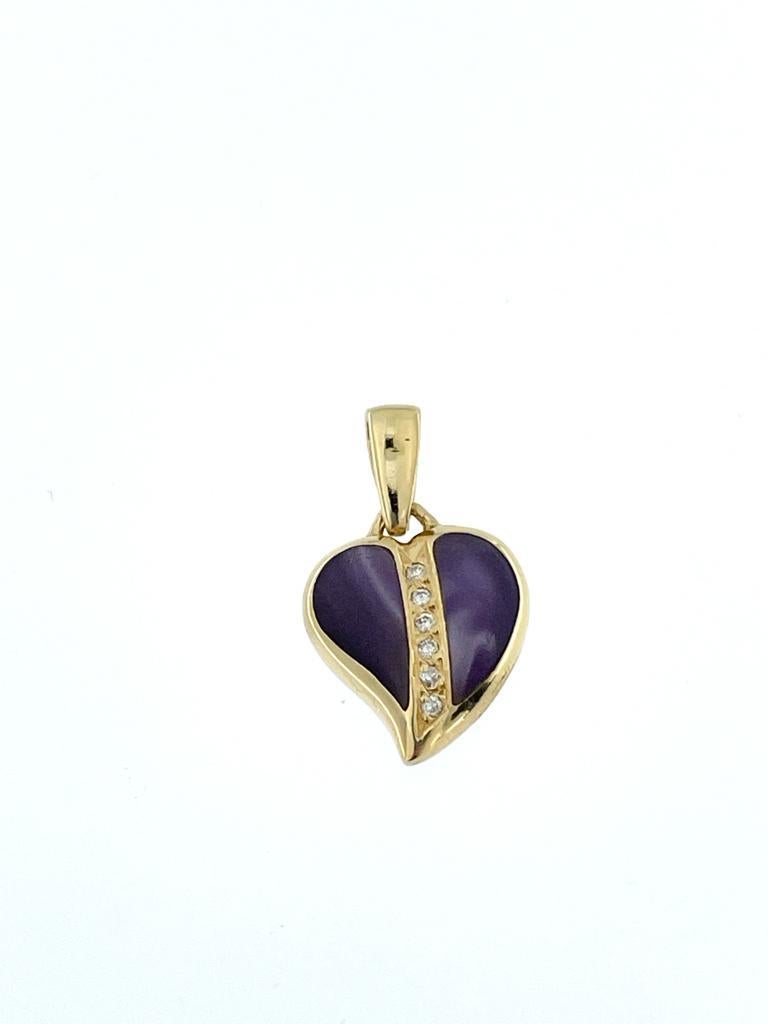 The French Heart Pendant in Yellow Gold with Diamonds and Violet Cabochon Scapolite is a delightful fusion of elegance and uniqueness. Crafted in 18-karat yellow gold, this pendant features a captivating combination of brilliant cut diamonds and two