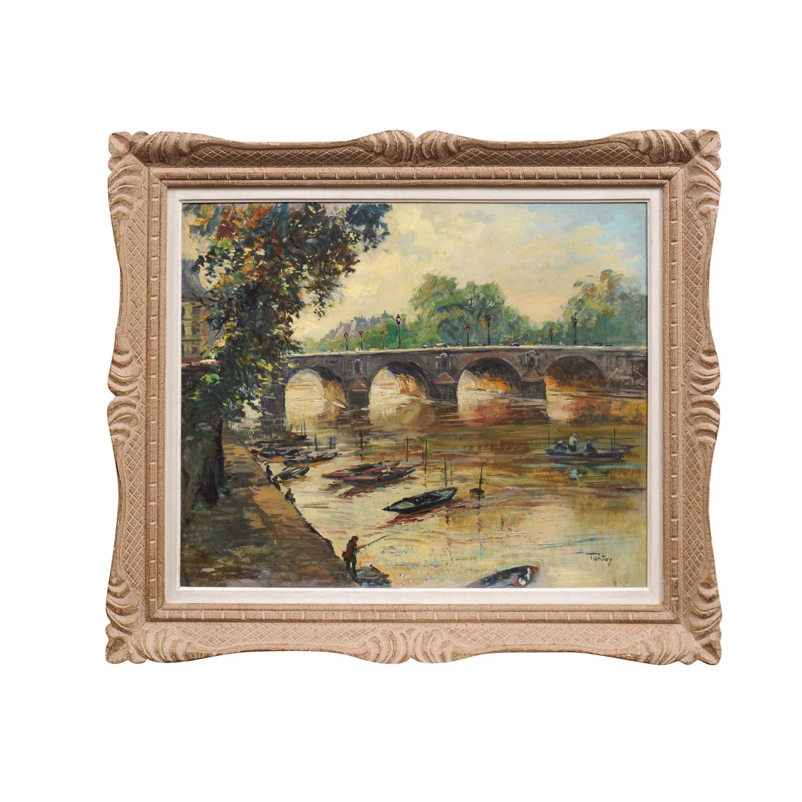 French Henri-Jean Pontoy oil on canvas painting of a Parisian scene depicting the Pont Neuf over the River Seine with fishermen and boats in the foreground in a carved wooden frame, signed lower right. This oil on canvas painting by French artist