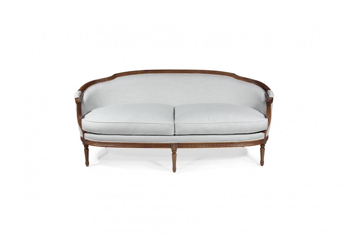 A stunning French Henrietta Louis XVI sofa, 20th century.

The Henrietta Louis XVI is shown in oak wood with a distressed honey finish.

Handcrafted in a range of sizes, woods and finishes. Traditionally upholstered with hand tied springs.