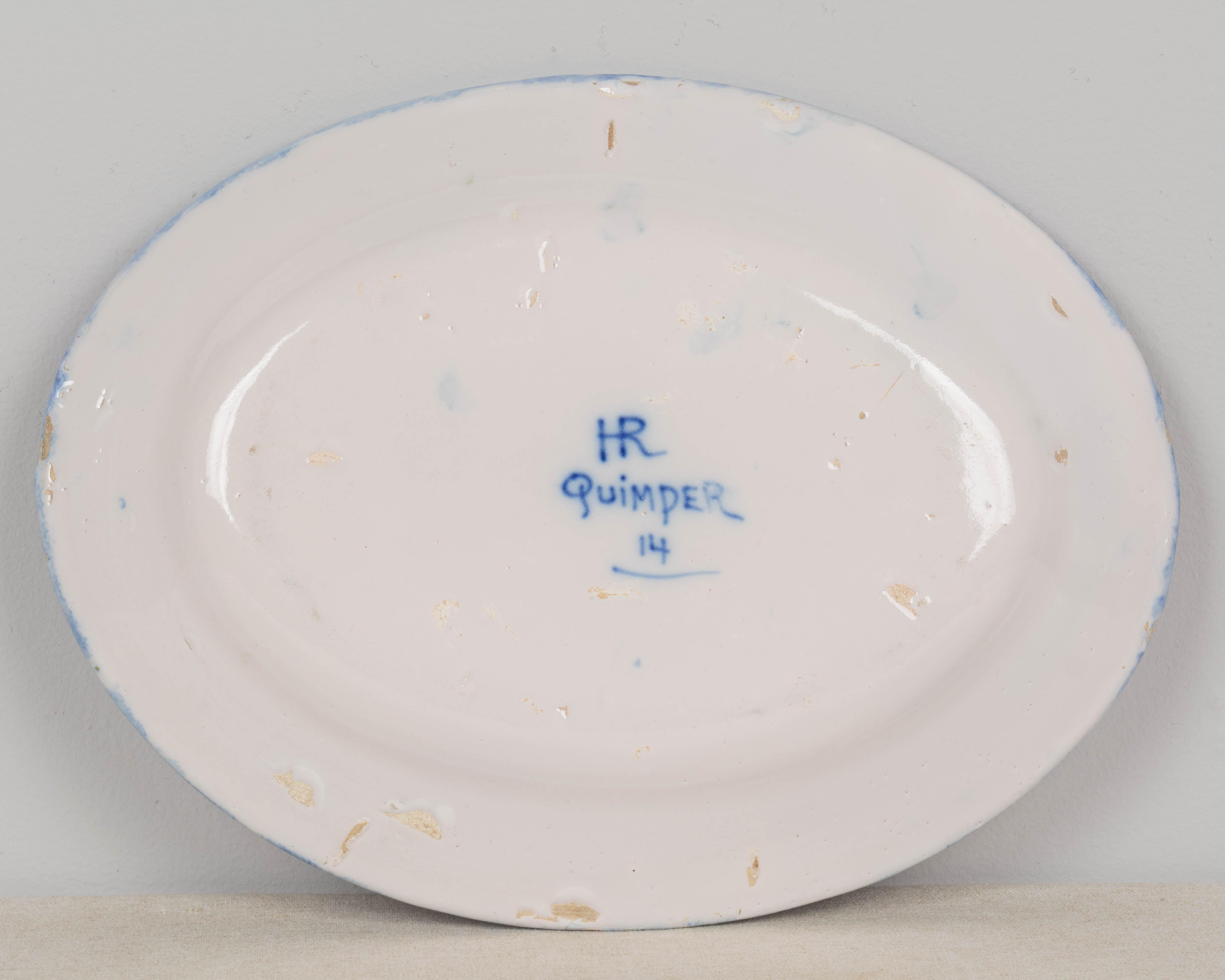 Plato francés de loza Henriot Quimper De campo en venta