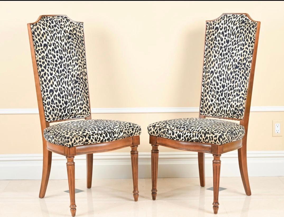 Set of 8 tall French style dining chairs with carved fluted and tapered legs. Leopard print ultra suede upholstery.