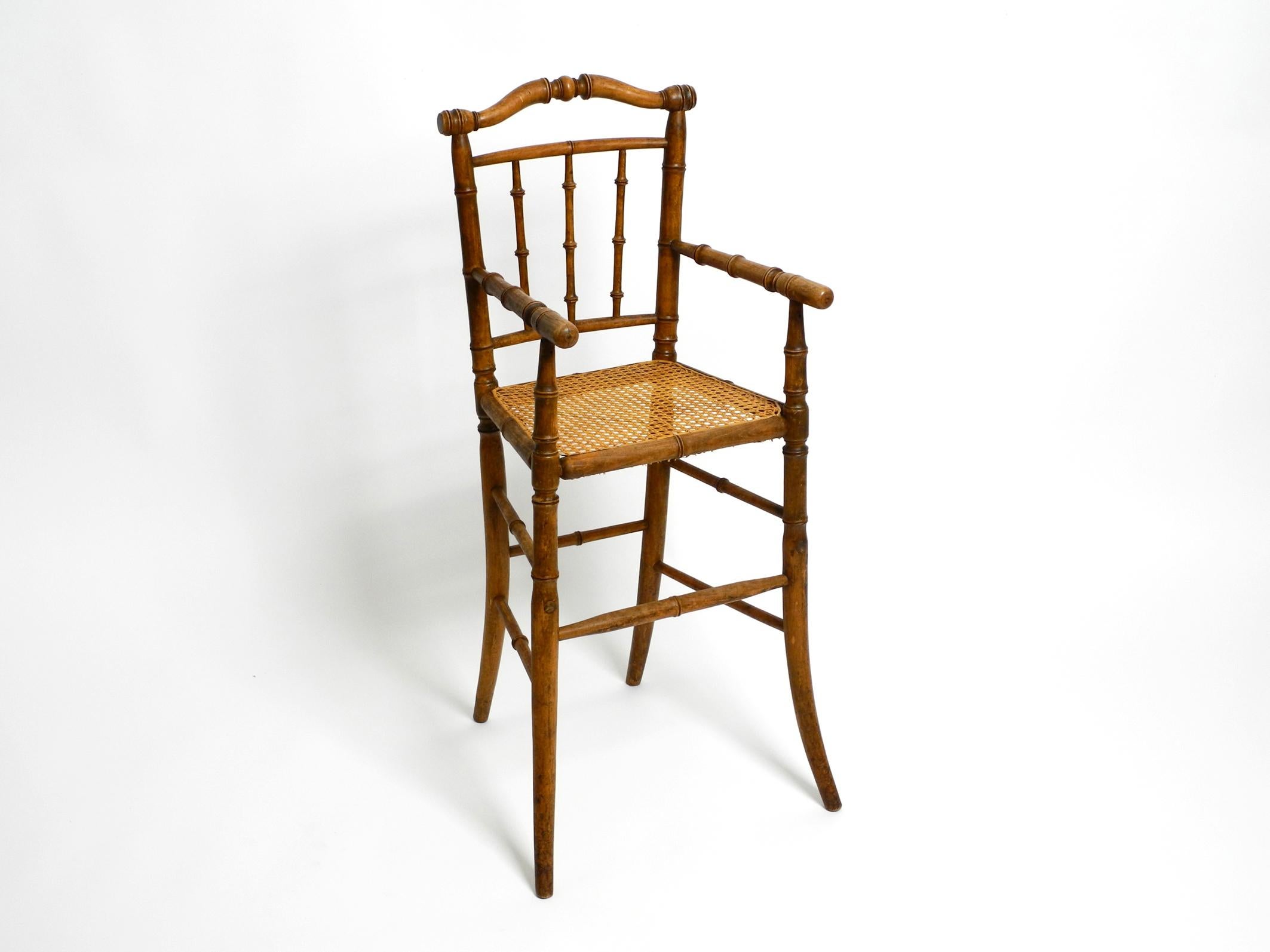 Beautiful high French table children's highchair from the 1930s in bentwood.
Bentwood is mostly made from maple or beech wood. Seat made of Viennese wicker.
Very good original vintage condition with no damage. The seat weave appears to be