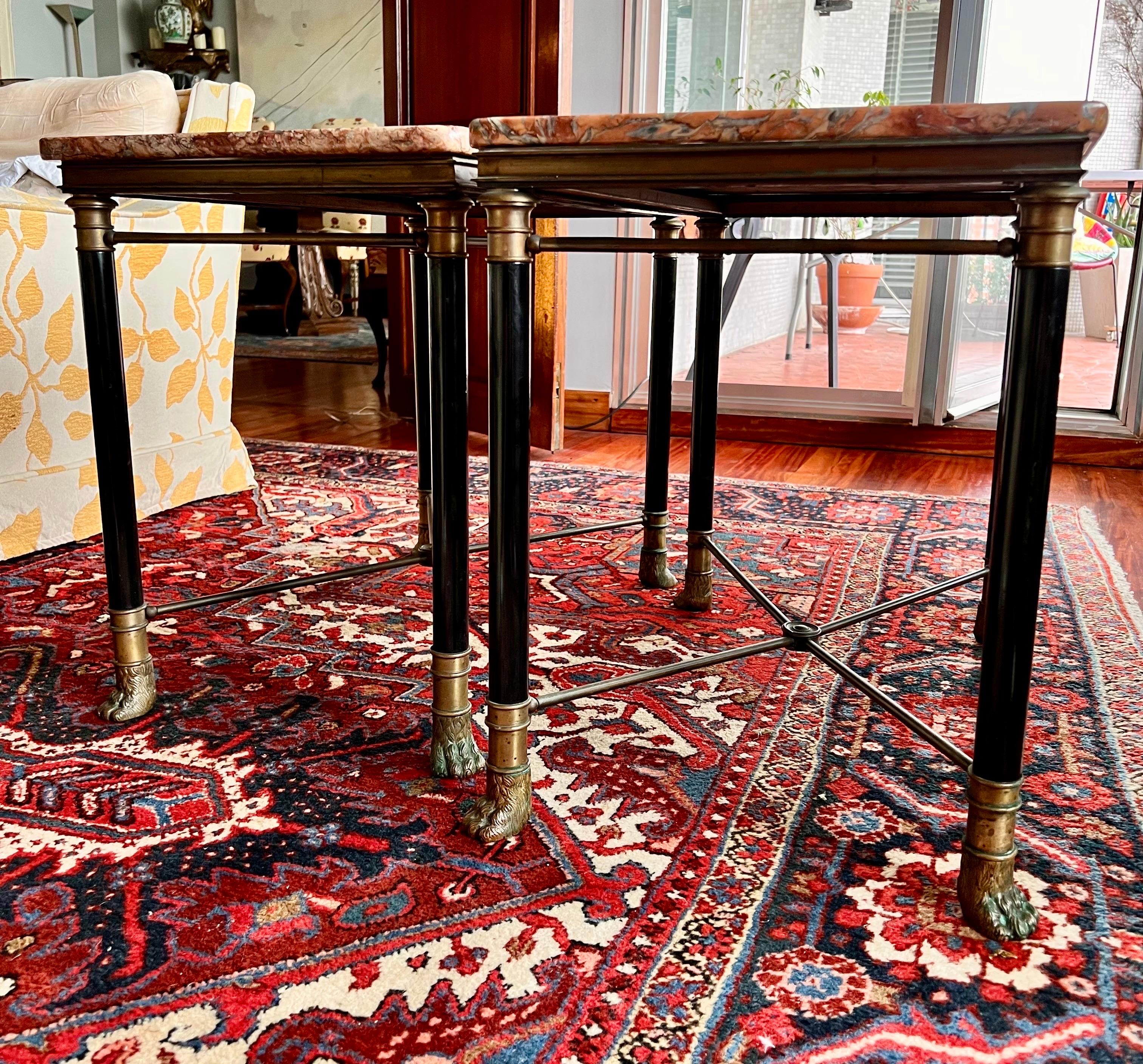 Magnificent Hollywood Maison Jansen style coffee tables.
Striking French design from the 1970s.
Dark green lacquered metal base on solid brass feet with lion feet.
 Mid Century Maison Jansen style table with French, Directoire or Campaign