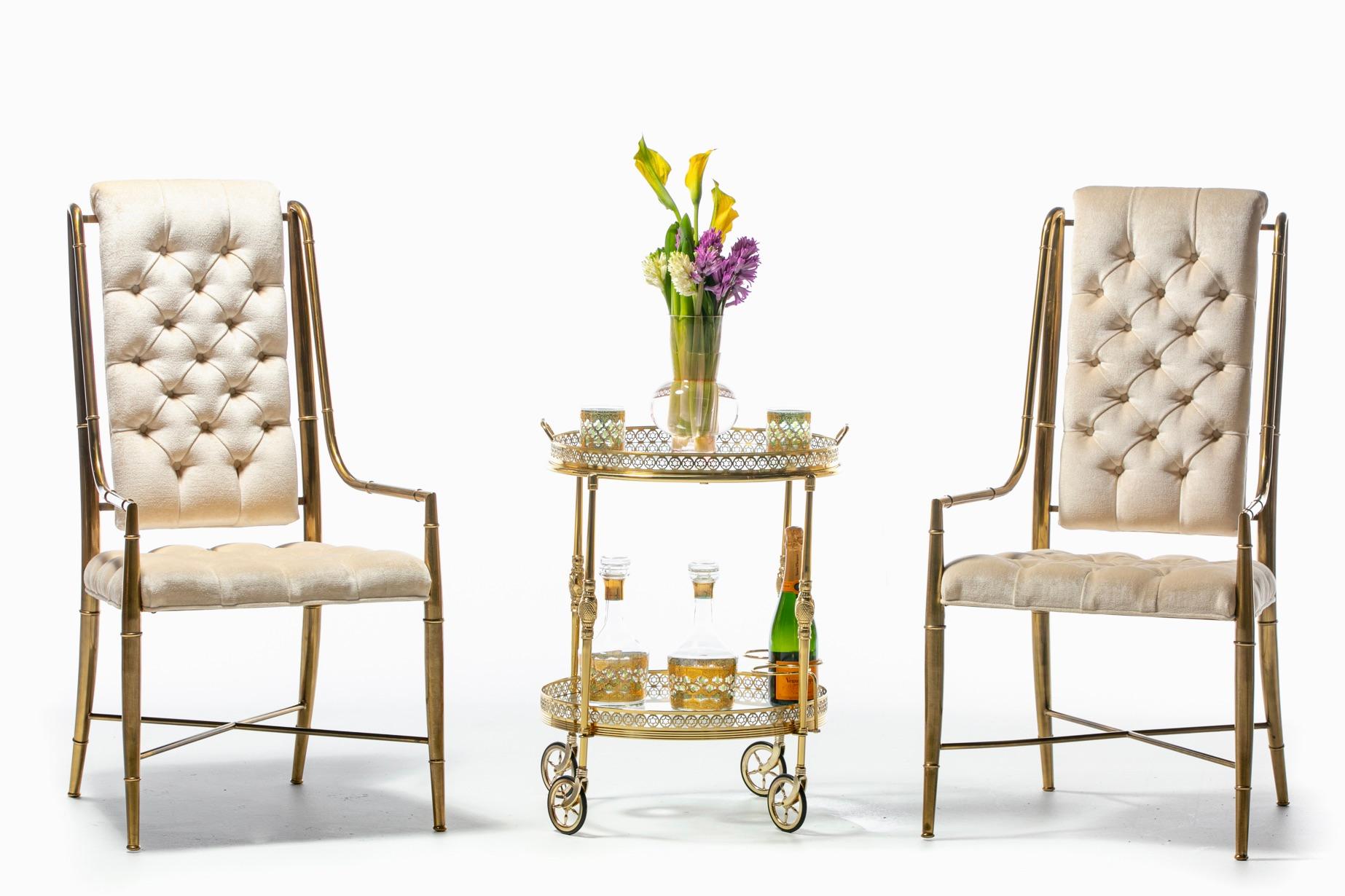Roll into cocktail hour in style with this chic French 1960s Hollywood Regency Maison Jansen / Maison Baguès attributed brass bar cart. Glamorous. Ornate. Festive. The details. Two tiers both with glass shelves surrounded by pierced brass galleries