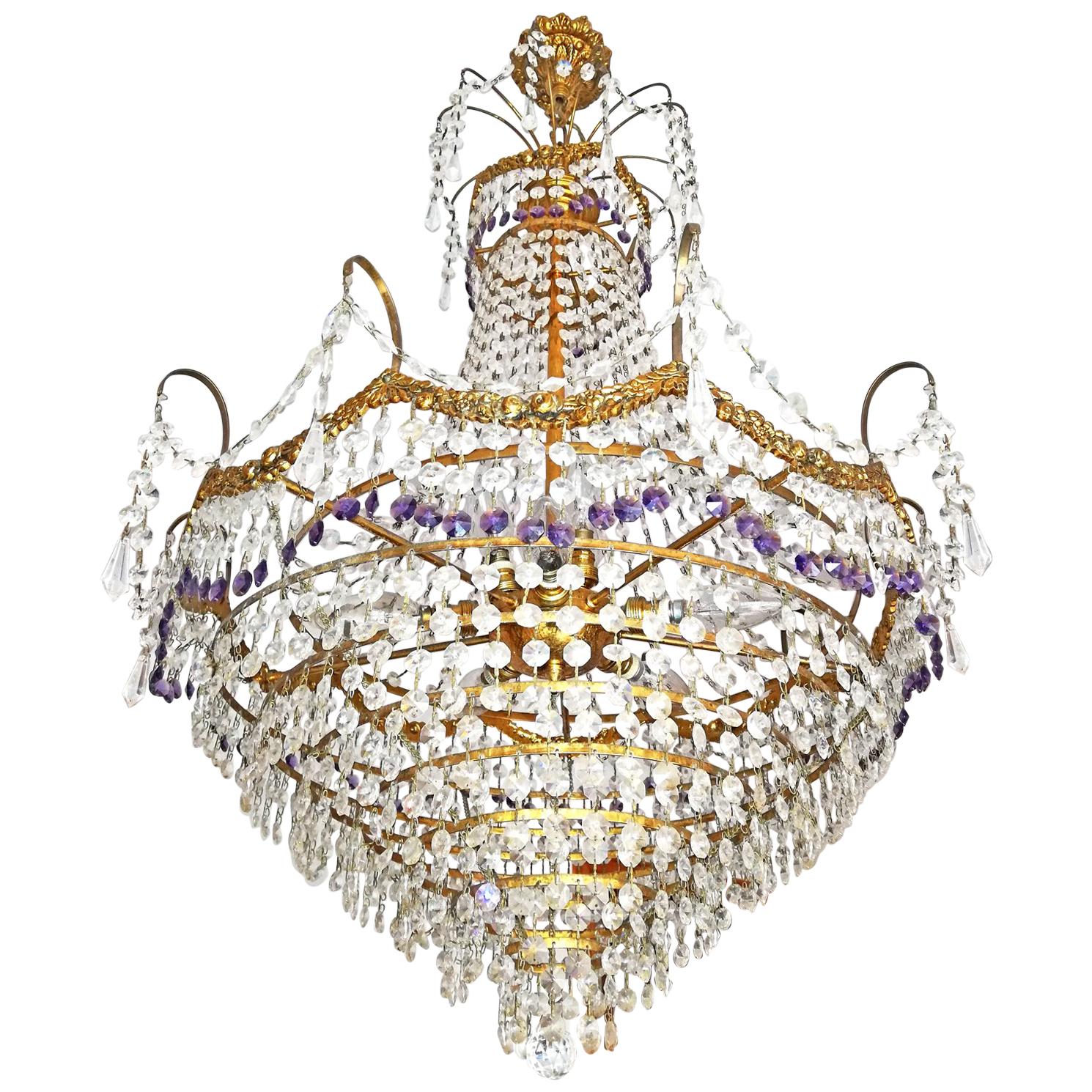 Stunning French Hollywood Regency Empire amethyst cut crystal and bronze 8-light chandelier with crystal drops and swags
Measures: 
Diameter: 24.5 in/ 62 cm
Height: 40 in / 100 cm
Weight: 22 lb/10 Kg
Eight light bulbs E14/ good working