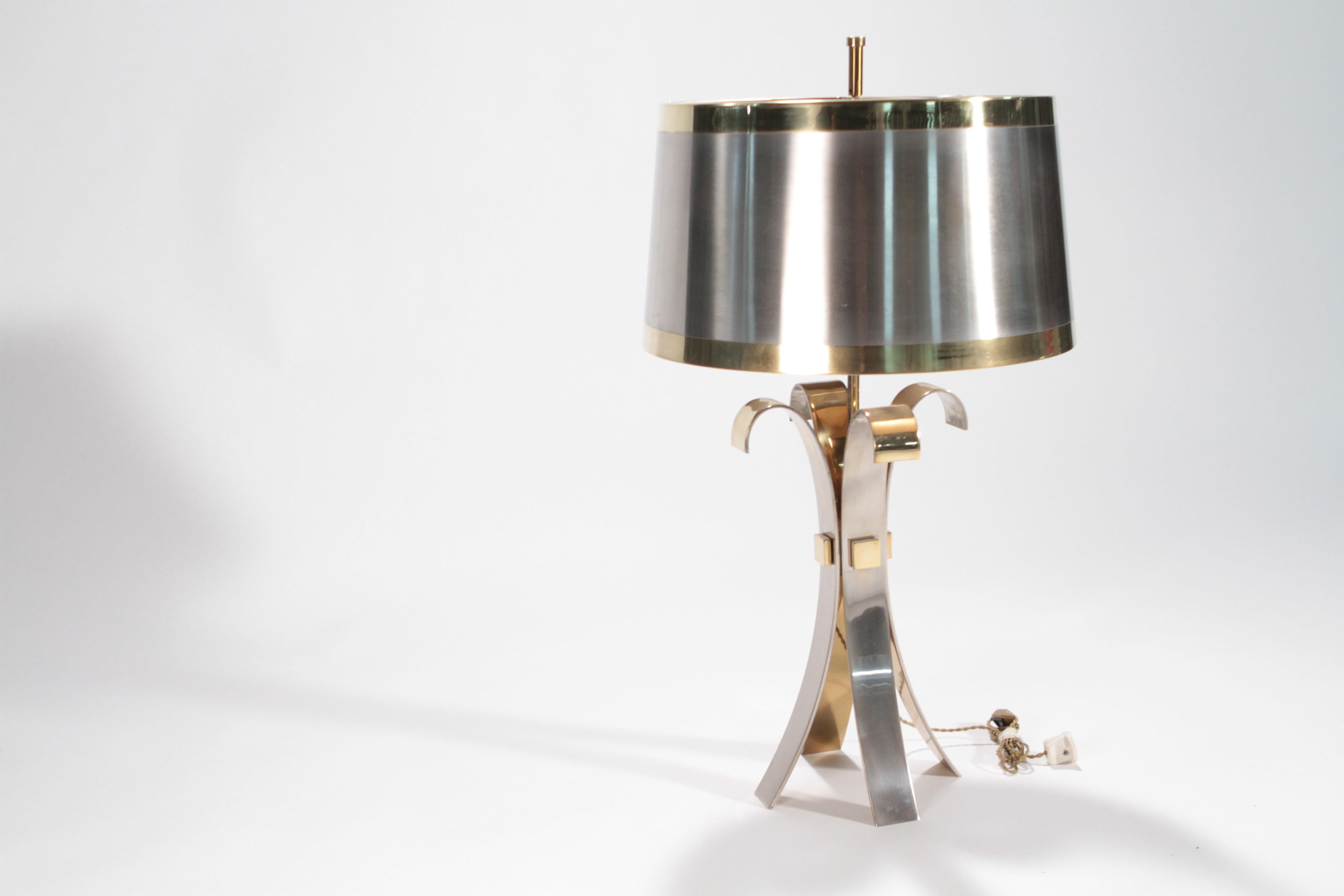 Heighten the modern look of your living area with this sculptural table lamp signed by Maison Charles made of brass and tin. This extravagant lamp is a piece of art, truly unique and will make a gracious compliment to both traditional and modern