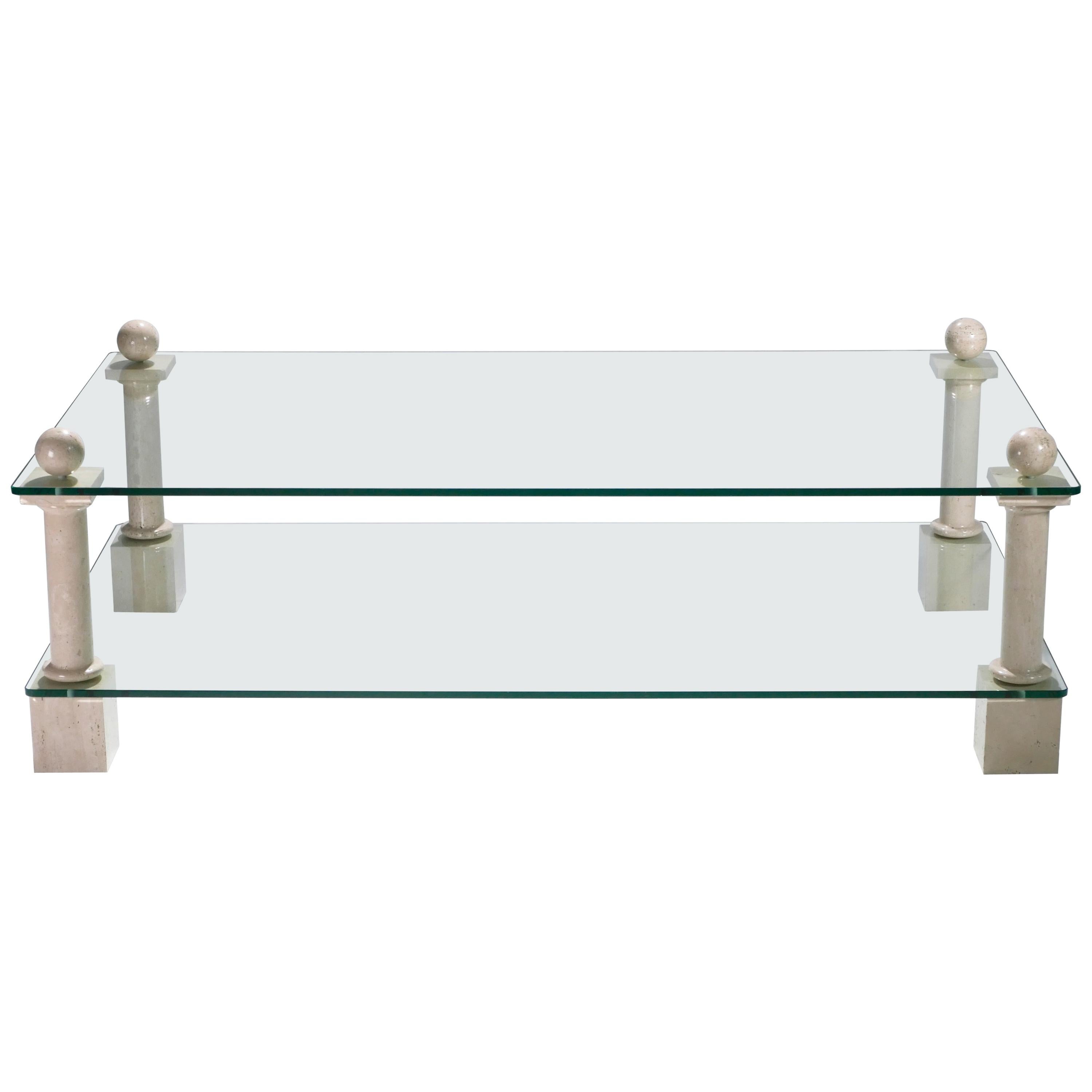 Crafted by French interior designer Philippe Barbier, this rare large coffee table mixes materials in the most sophisticated way. Tiered, thick glass slabs are supported by elegant travertine feet. Decorators might choose to place this French